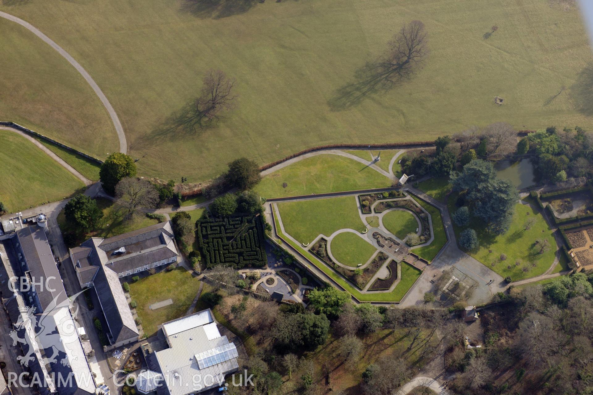 Bodelwyddan Castle and its garden, west of St. Asaph. Oblique aerial photograph taken during the Royal Commission?s programme of archaeological aerial reconnaissance by Toby Driver on 28th February 2013.