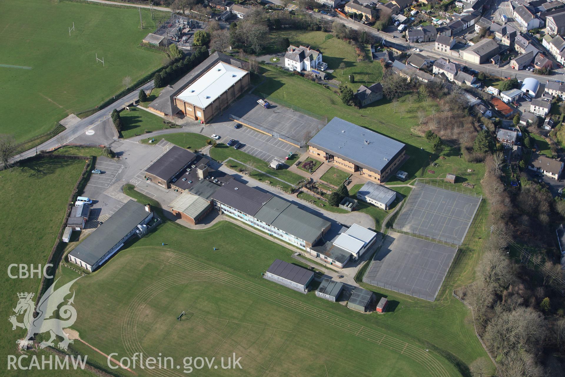 RCAHMW colour oblique aerial photograph of Newcastle Emlyn, comprehensive school. Taken on 13 April 2010 by Toby Driver