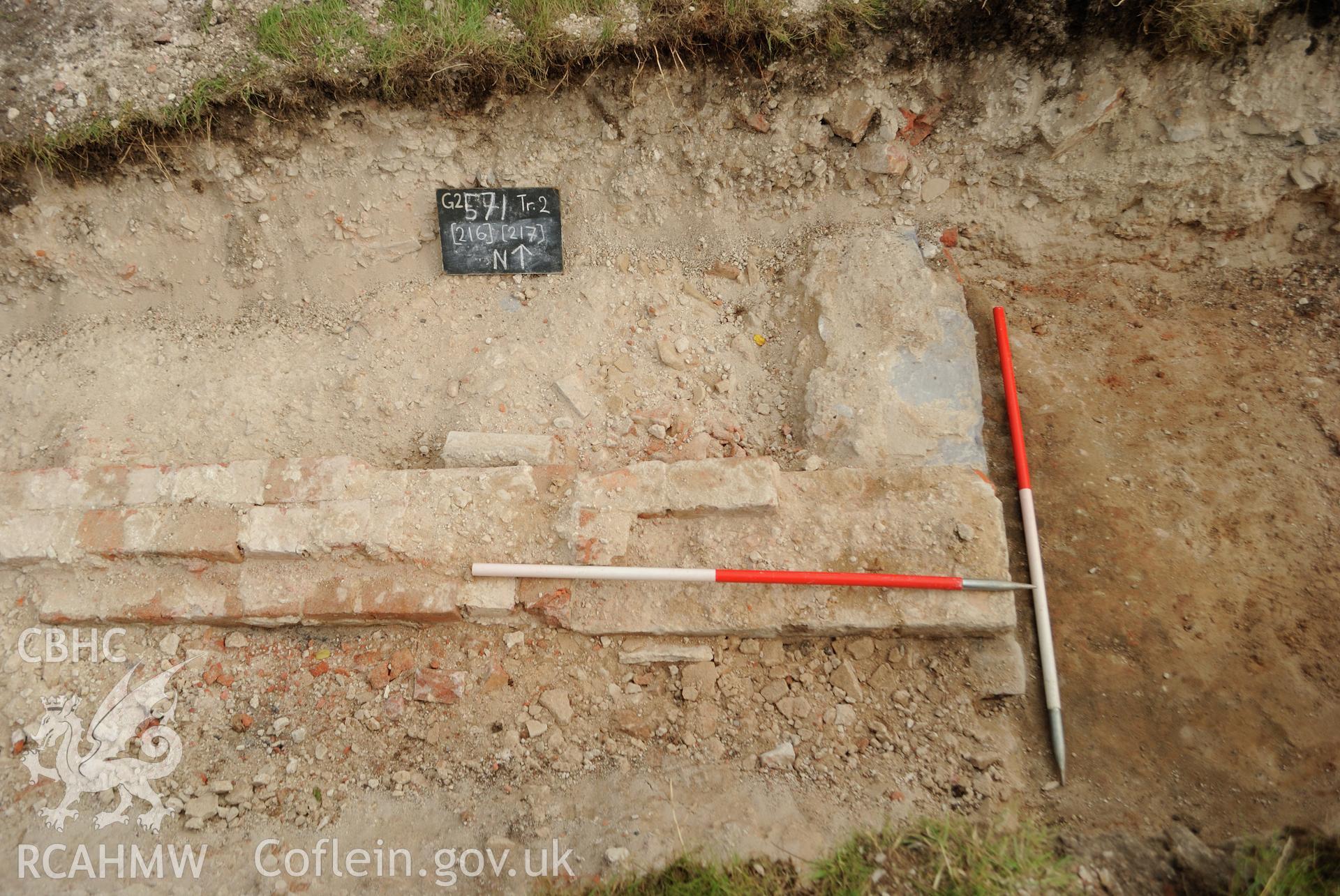 View from south (post excavation) of east facing elevation of brick walled feature & slate threshold above. Photographed during archaeological evaluation of Kinmel Park, Abergele, conducted by Gwynedd Archaeological Trust, 24/08/2018. Project no. 2571.