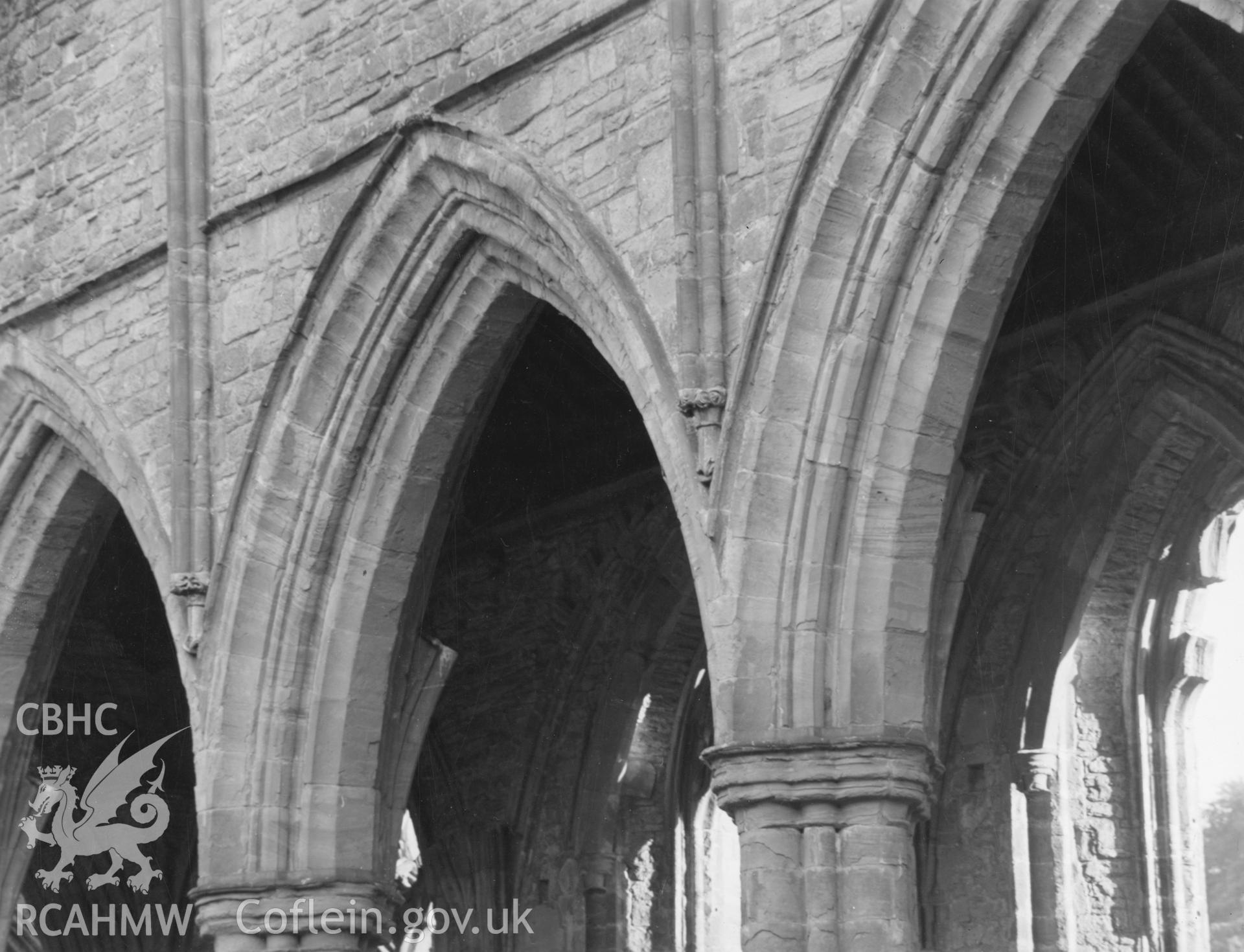 Digital copy of a photograph showing arches in the south of the nave at Tintern Abbey taken by Shirley Jones, dated 1943.
