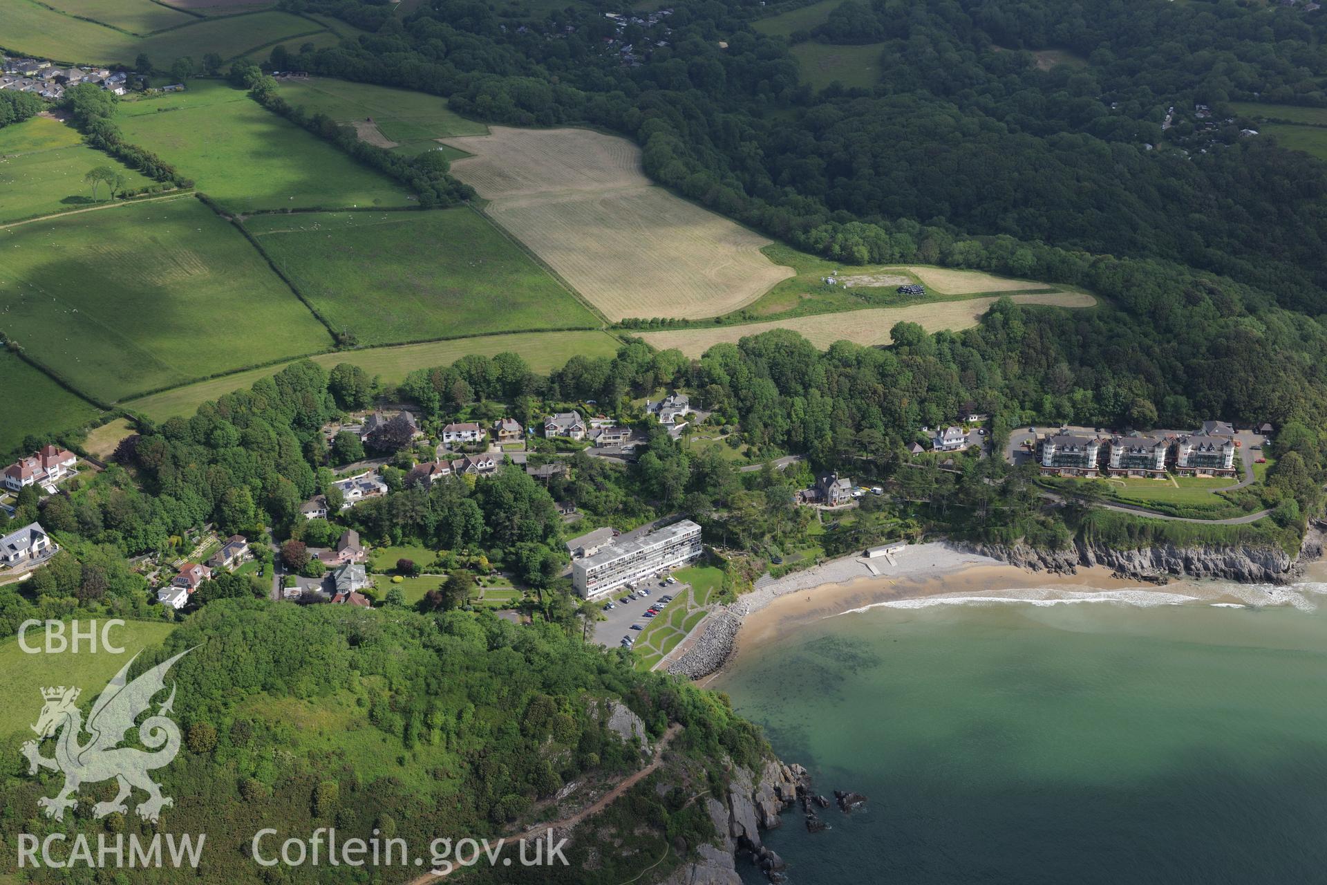 Caswell Cliff Fort, Victoria Villa and housing at Caswell Bay. Oblique aerial photograph taken during the Royal Commission's programme of archaeological aerial reconnaissance by Toby Driver on 19th June 2015.