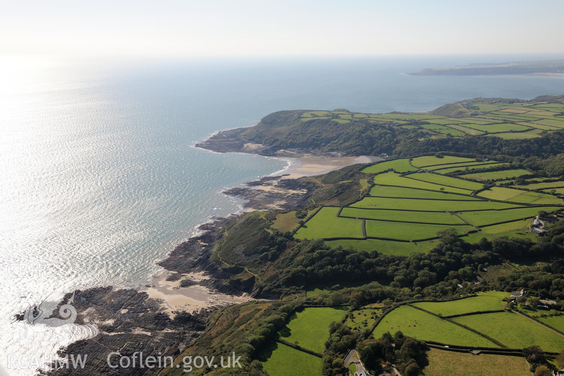 Caswell Bay, west of the Mumbles, on the southern coast of the Gower Peninsula. Oblique aerial photograph taken during the Royal Commission's programme of archaeological aerial reconnaissance by Toby Driver on 30th September 2015.