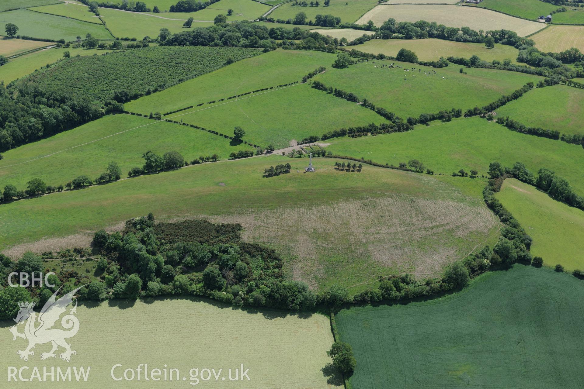 Montgomeryshire war memorial and a possible prehistoric defenced enclosure at Town Hill, Montgomery. Oblique aerial photograph taken during the Royal Commission's programme of archaeological aerial reconnaissance by Toby Driver on 30th June 2015.