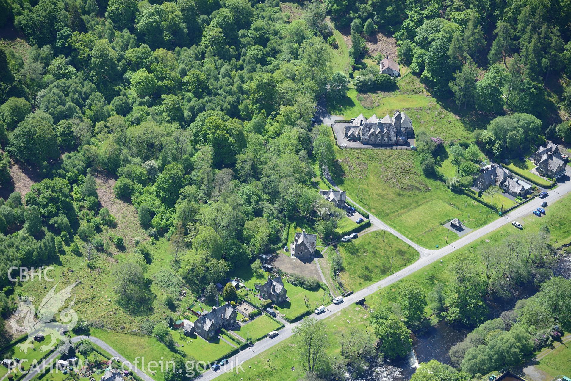 Elan model village corporation school, estate office, houses and stone bridge. Oblique aerial photograph taken during the Royal Commission's programme of archaeological aerial reconnaissance by Toby Driver on 3rd June 2015.