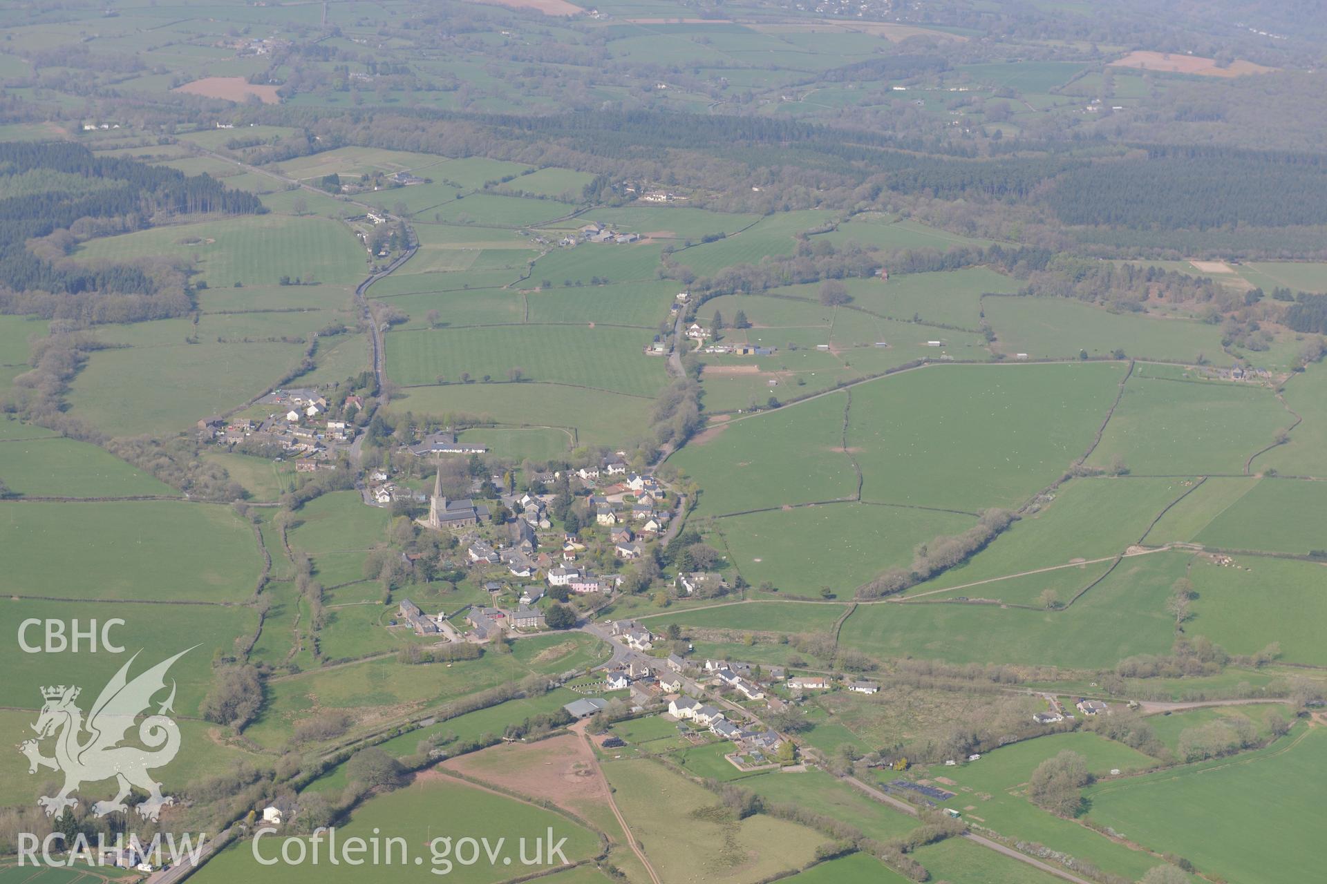 Trellech village and medieval borough including St. Nicholas' Church and the Vicarage; medieval houses sites west of the Church, Trellech motte, the Lion Inn and Old Village School. Oblique aerial photograph taken during the Royal Commission's programme of archaeological aerial reconnaissance by Toby Driver on 21st April 2015.