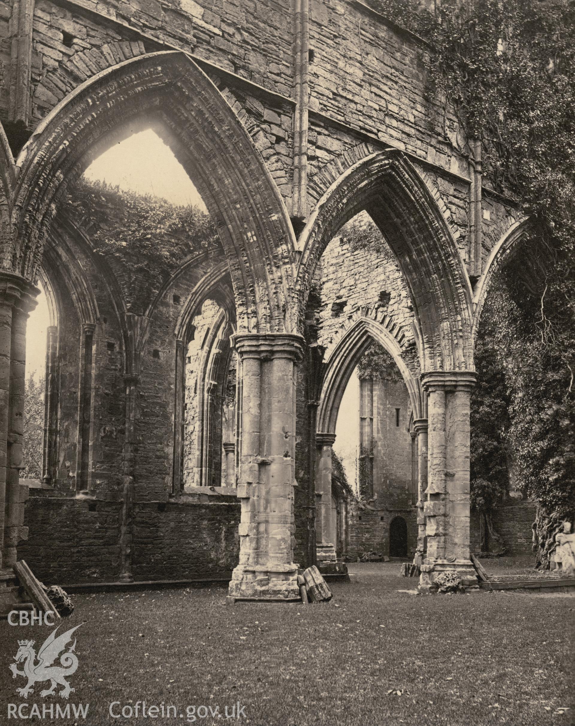 Digital copy of a circa 1870 albumen print showing an interior view of Tintern Abbey looking across the nave.