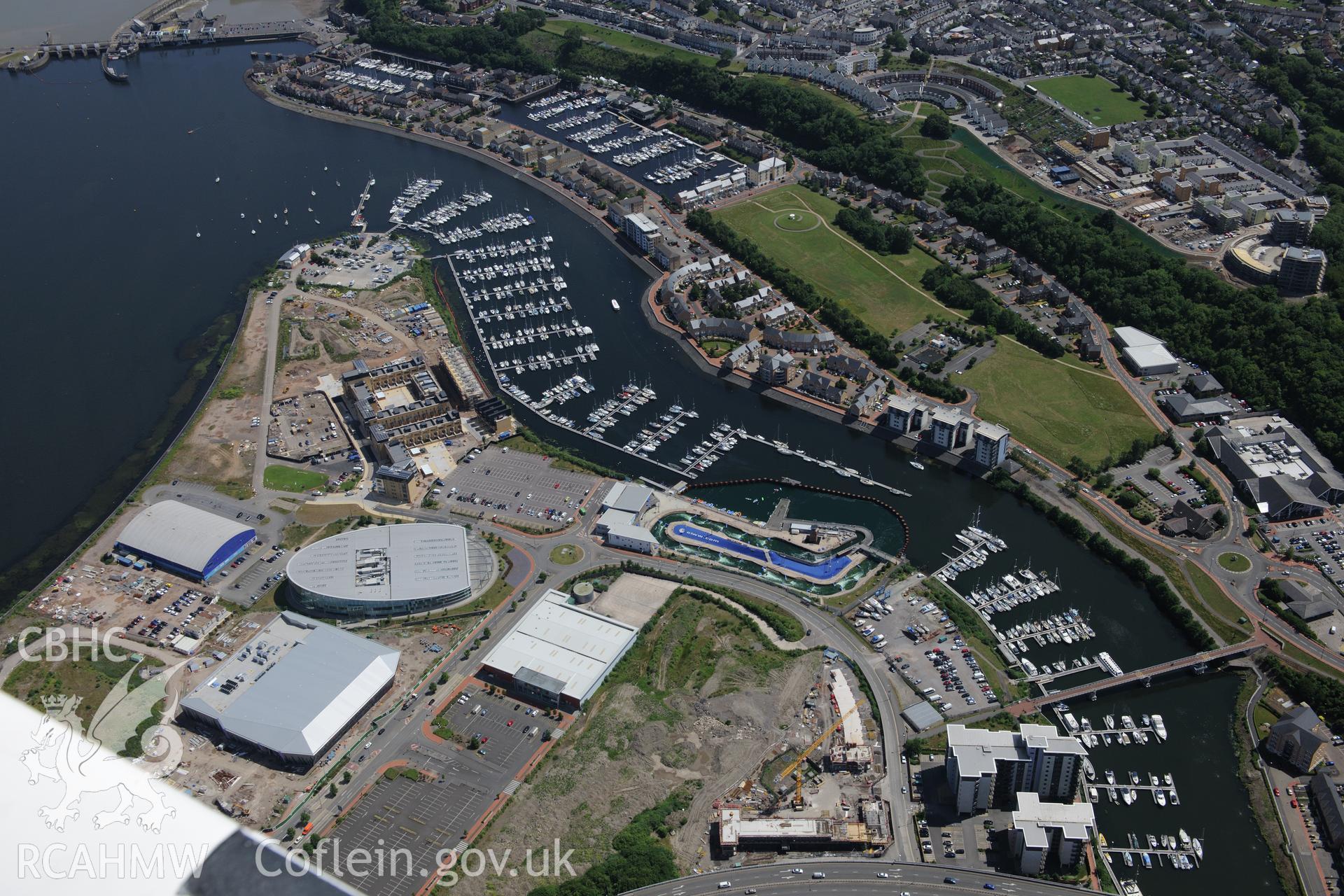 Cardiff International Pool and White Water Centre, and Penarth Dock, Cardiff Bay. Oblique aerial photograph taken during the Royal Commission's programme of archaeological aerial reconnaissance by Toby Driver on 29th June 2015.