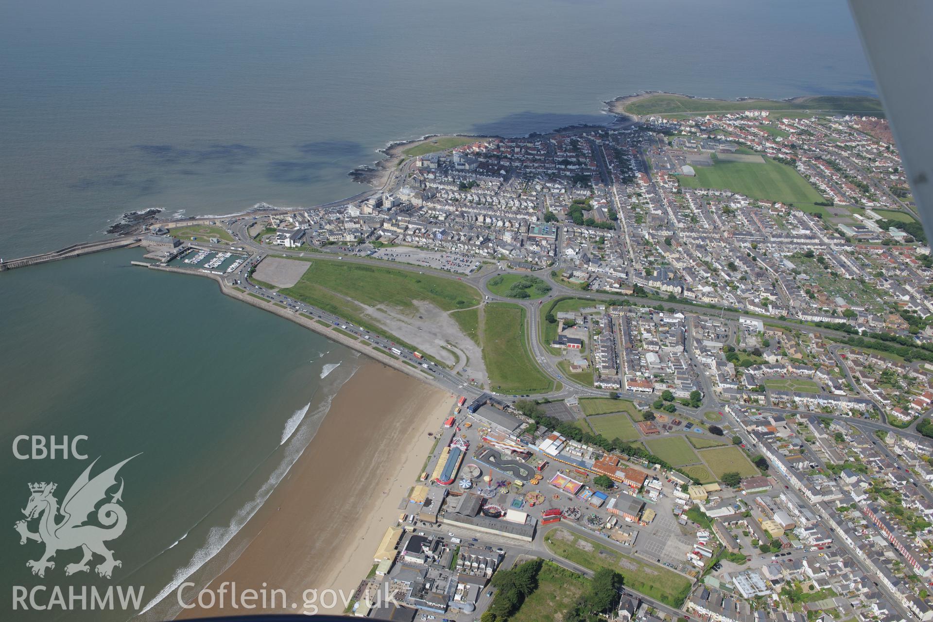 Views of Porthcawl Harbour, lifeboat station, coastguard station and the town of Porthcawl. Oblique aerial photograph taken during the Royal Commission's programme of archaeological aerial reconnaissance by Toby Driver on 19th June 2015.