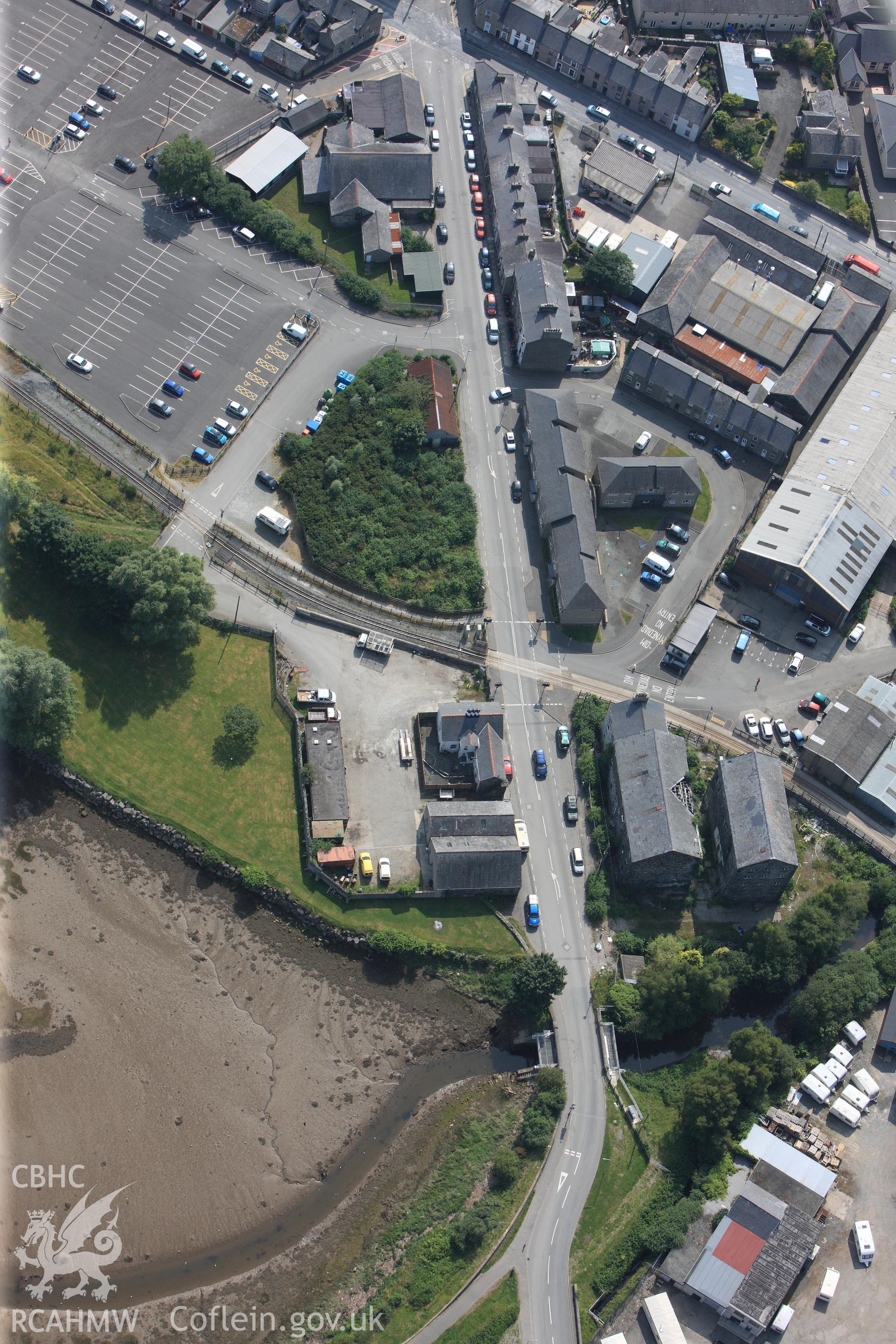 Snowdon Street Corn Mill, Porthmadog. Oblique aerial photograph taken during the Royal Commission?s programme of archaeological aerial reconnaissance by Toby Driver on 12th July 2013.