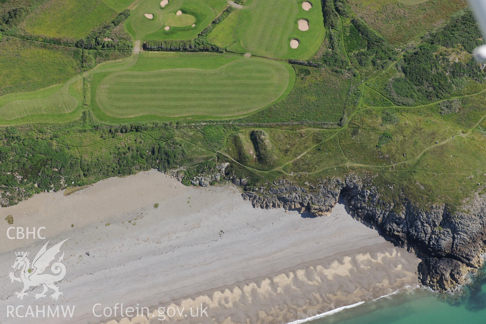 Flint find spot on the cliffs and a disused rifle range on Pen-ychain beach. Oblique aerial photograph taken during the Royal Commission's programme of archaeological aerial reconnaissance by Toby Driver on 23rd June 2015.