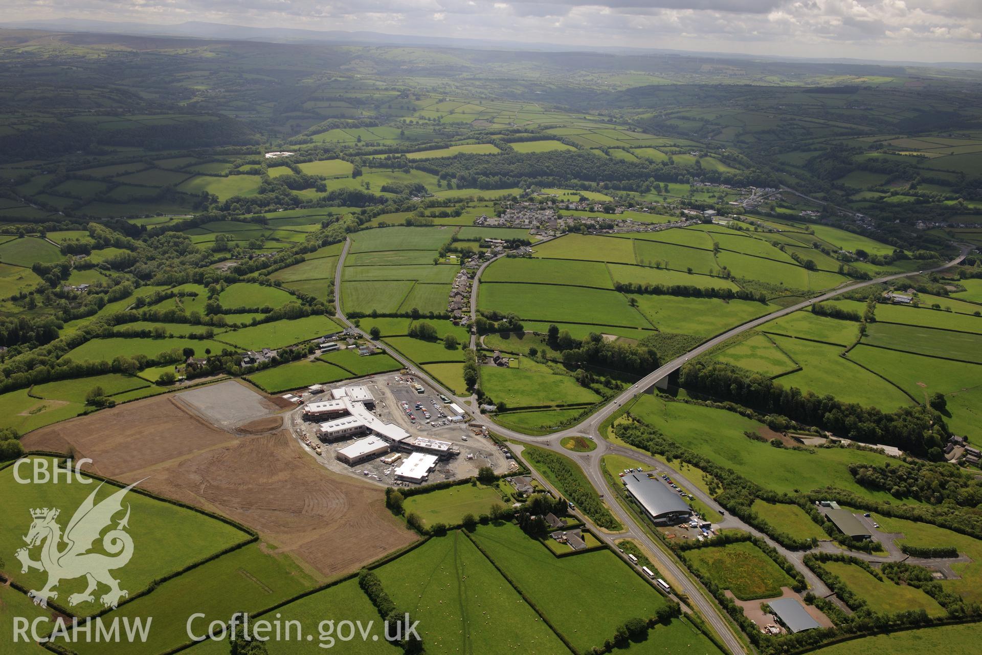 Landscape view showing Ysgol Bro Teifi, Llandysul bypass and Llandysul town. Oblique aerial photograph taken during the Royal Commission's programme of archaeological aerial reconnaissance by Toby Driver on 3rd June 2015.