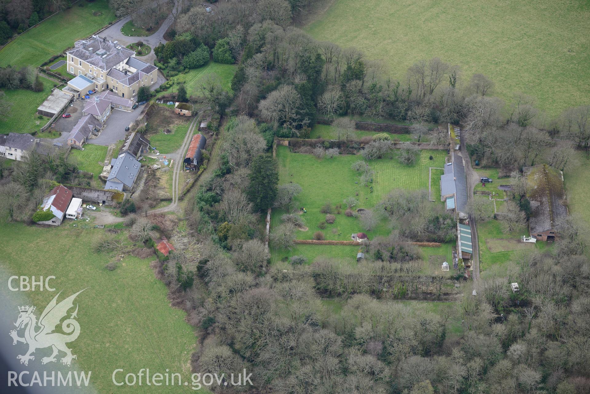 Pen-y-Lan Hall mansion; garden and outbuildings, Llandygwydd, Cardigan. Oblique aerial photograph taken during the Royal Commission's programme of archaeological aerial reconnaissance by Toby Driver on 13th March 2015.