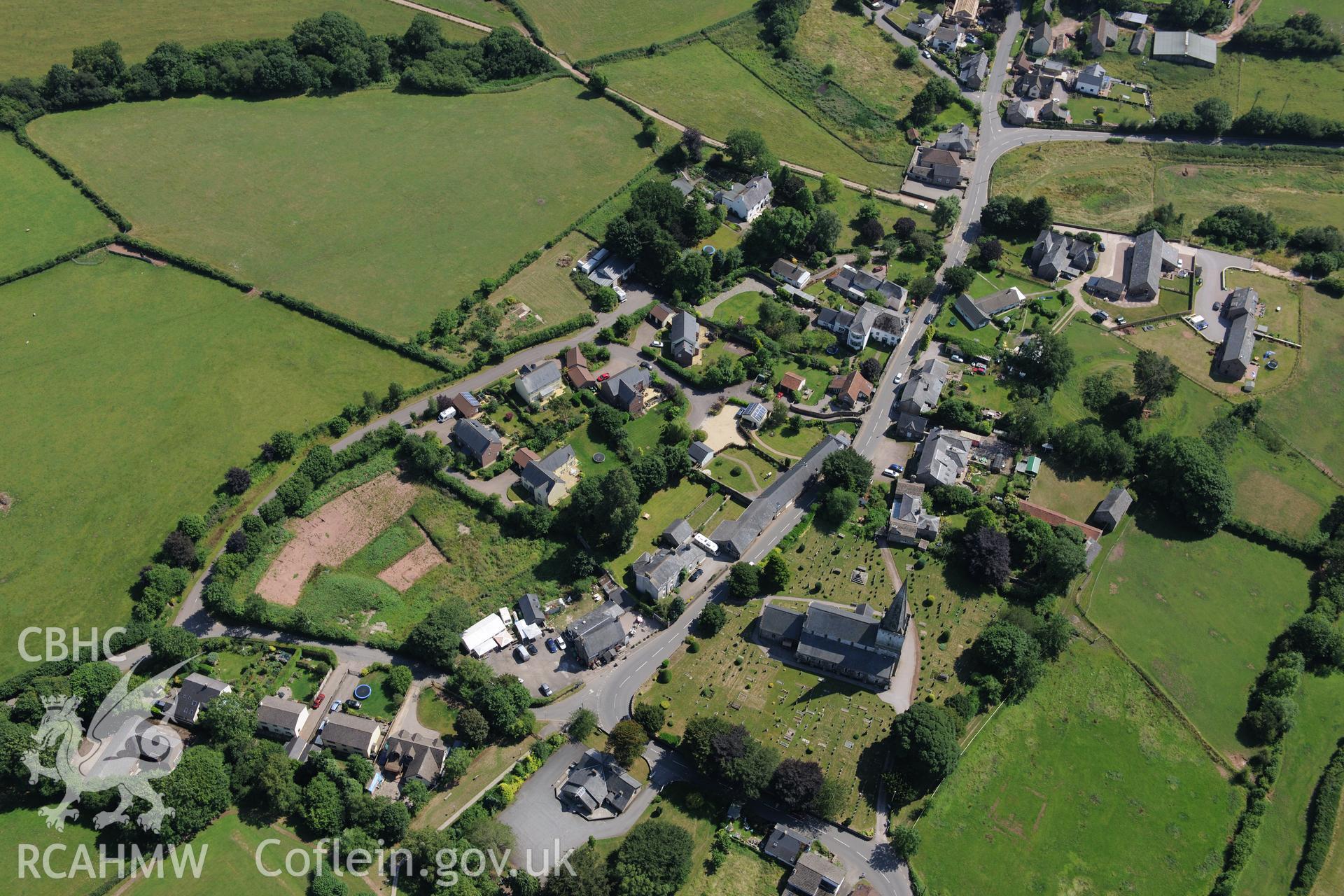 St Nicholas' Church in the village of Trellech, south of Monmouth. Oblique aerial photograph taken during the Royal Commission?s programme of archaeological aerial reconnaissance by Toby Driver on 1st August 2013.