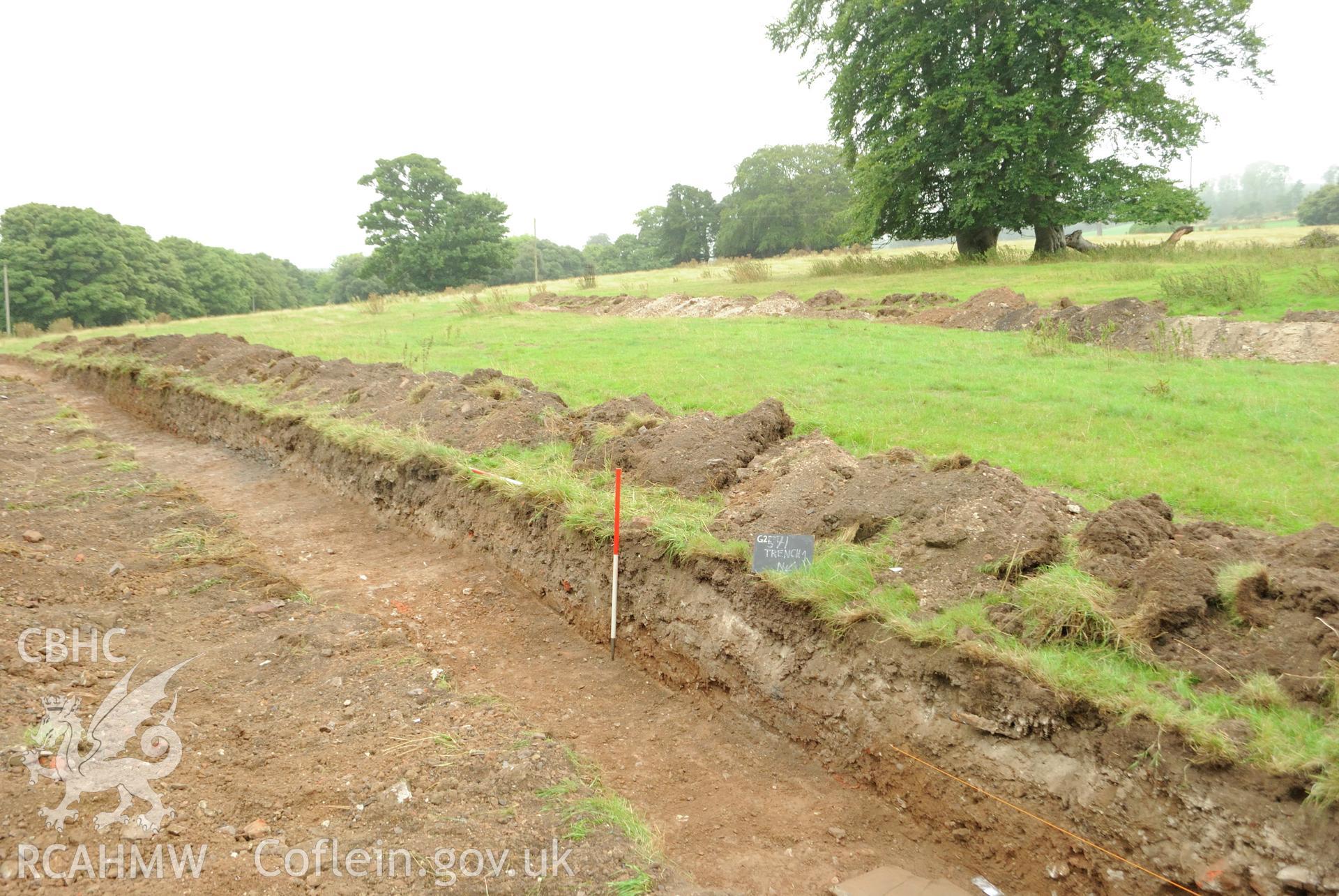Oblique shot from the north east of Trench 1. Photographed during archaeological evaluation of Kinmel Park, Abergele, conducted by Gwynedd Archaeological Trust on 22nd August 2018. Project no. 2571.