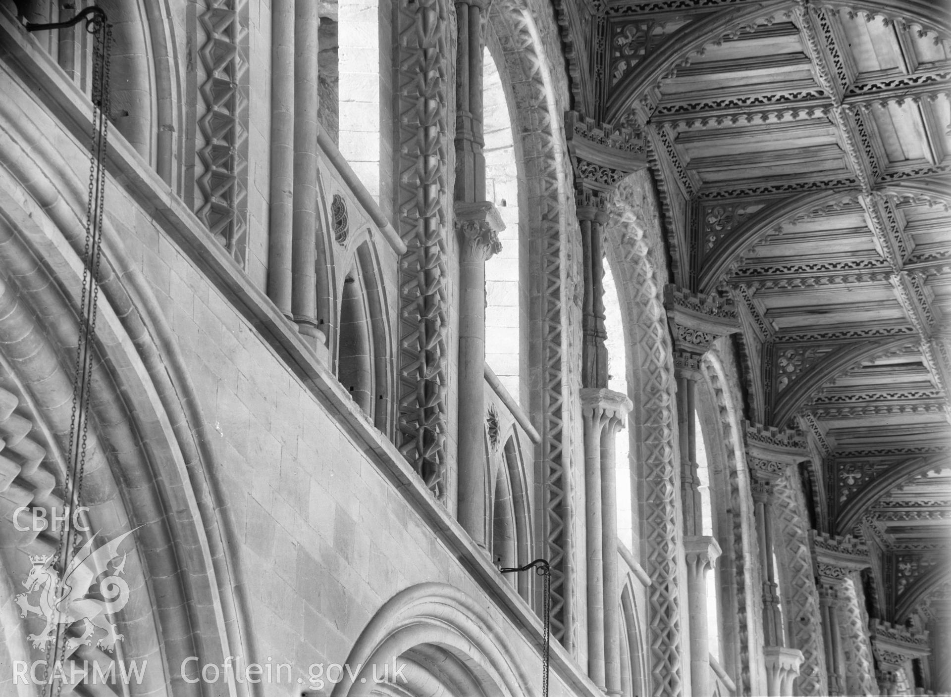 Digital copy of a black and white nitrate negative showing decorated arches and ceiling pendants at St. David's Cathedral, taken by E.W. Lovegrove, July 1936