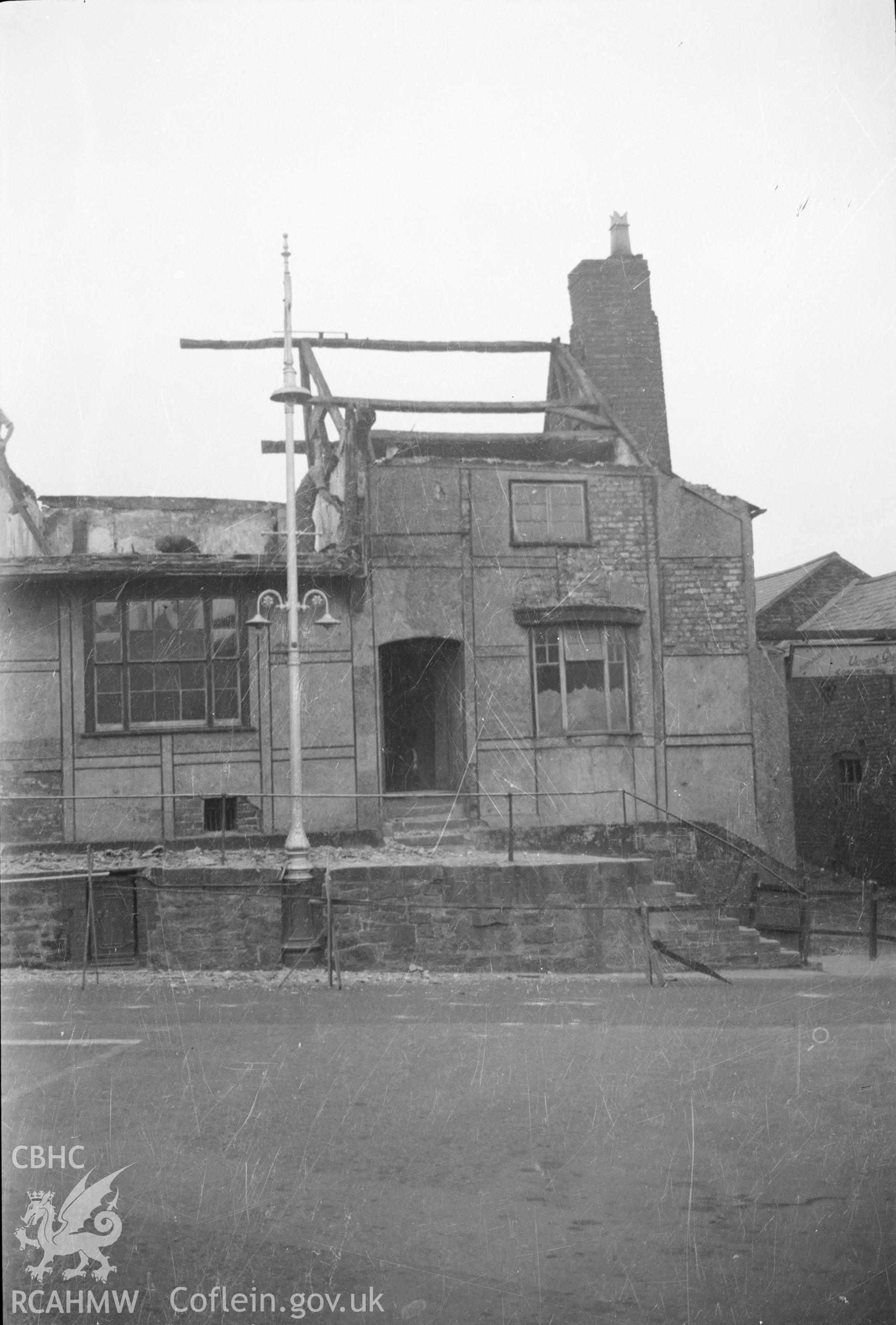 Digital copy of a nitrate negative showing an unidentified building in Wrexham - demolition in progress, taken by RCAHMW.