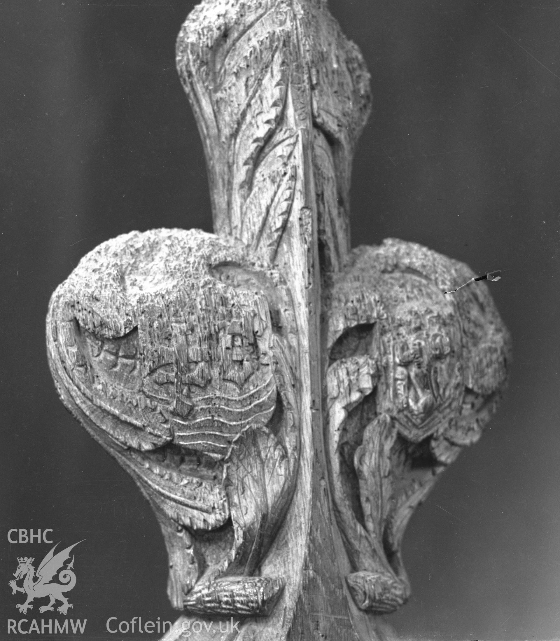 Digital copy of a black and white acetate negative showing detail of poppyhead in St. David's Cathedral, taken by E.W. Lovegrove, July 1936