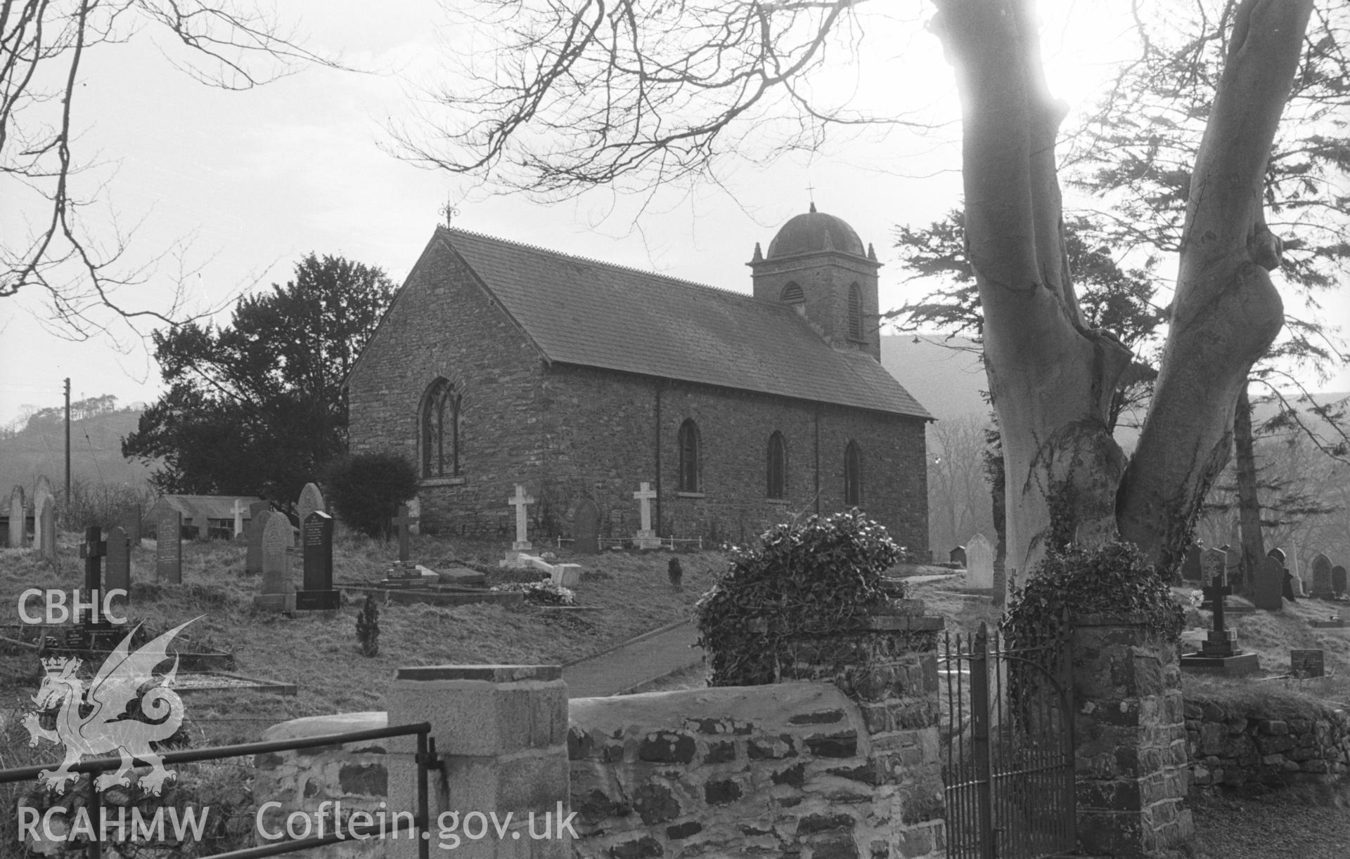 Black and White photograph showing St Non's church from the road, Llanerchaeron. Photographed by Arthur Chater in April 1963 from Grid Reference SN 476 604, looking south west.