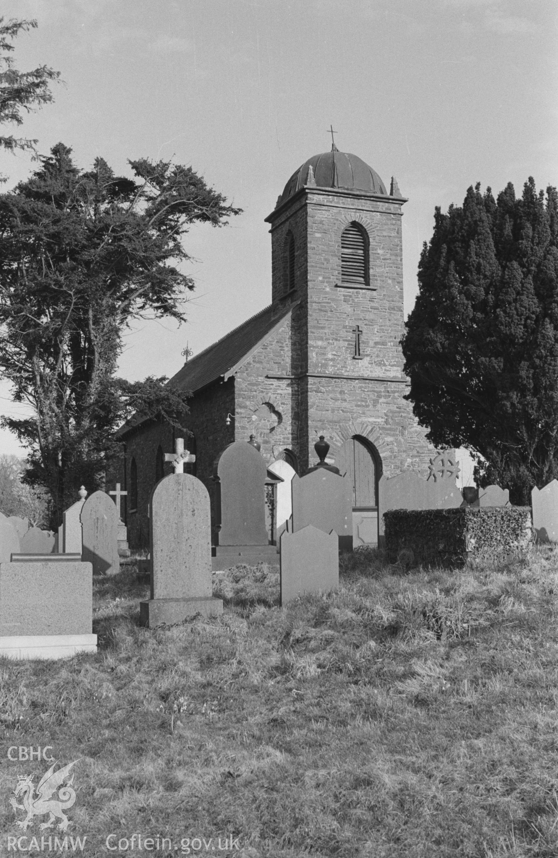 Black and White photograph showing St Non's church from the corner of the churchyard, Llanerchaeron. Photographed by Arthur Chater in April 1963 from Grid Reference SN 477 604, looking south east.