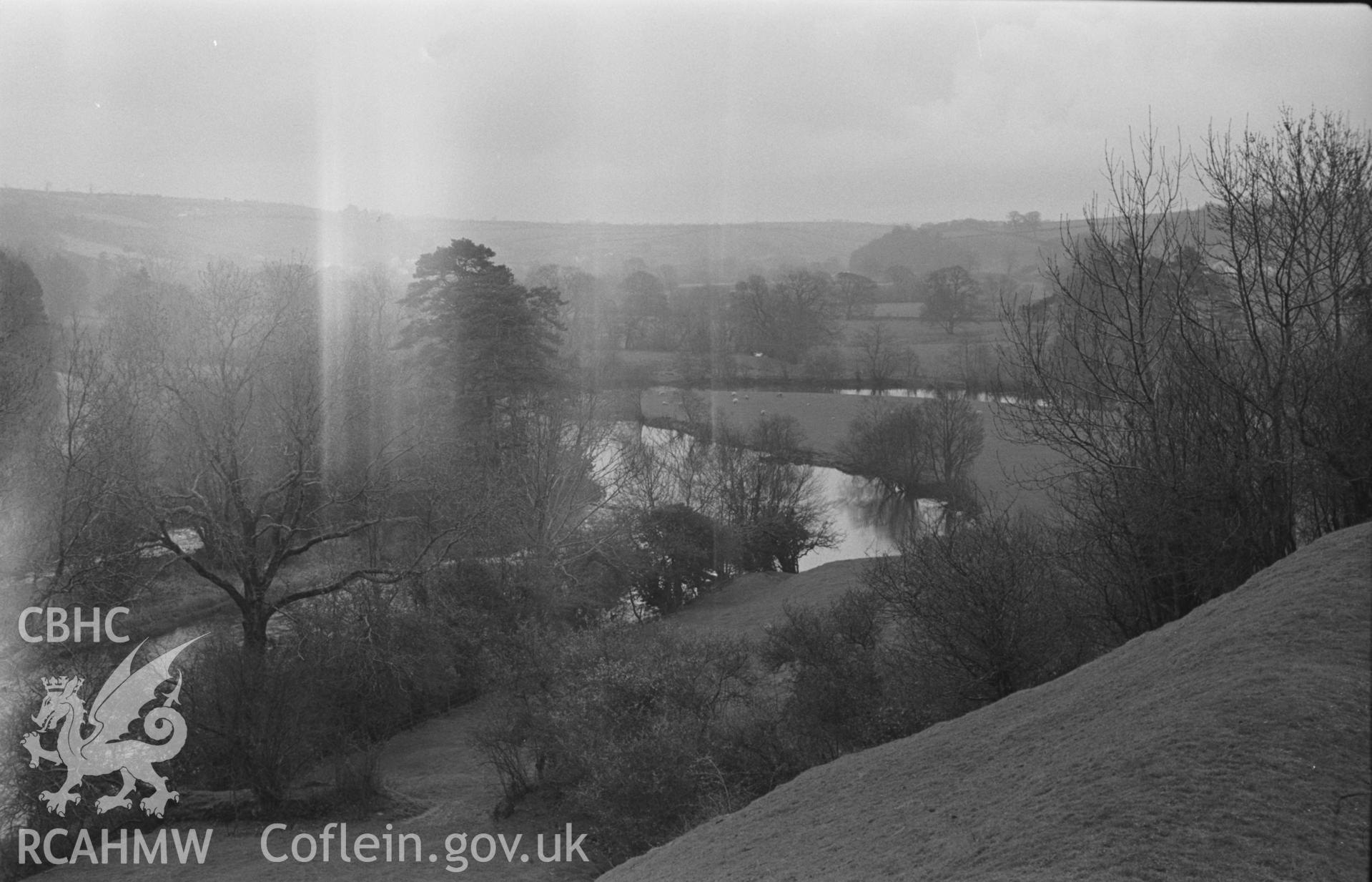 Black and White photograph showing views up the Teifi from the northern slope of the castle hill. Photographed by Arthur Chater in April 1962 from Grid Reference SN 312 408, looking east.