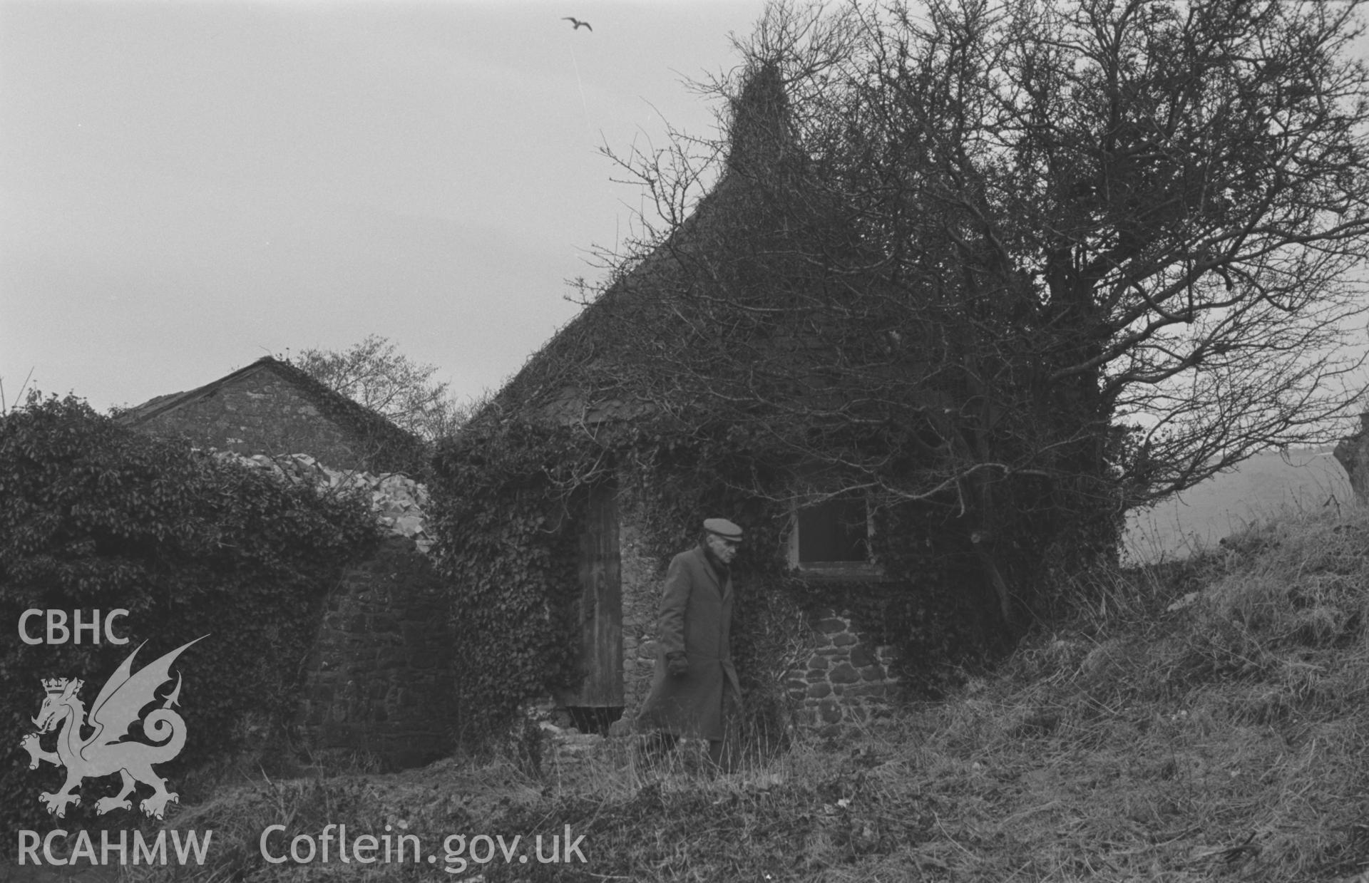 Black and White photograph showing chalybeate well house at Aberaeron with figure. Built in 1879, on the east side of the Aeron. Photographed by Arthur Chater, February 1963. Grid ref SN 4585 6268, looking north west.