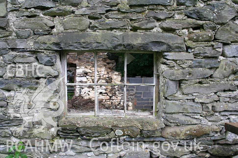 Downhouse end of Allt Ddu farmhouse, window in west wall, OS benchmark on lintel.