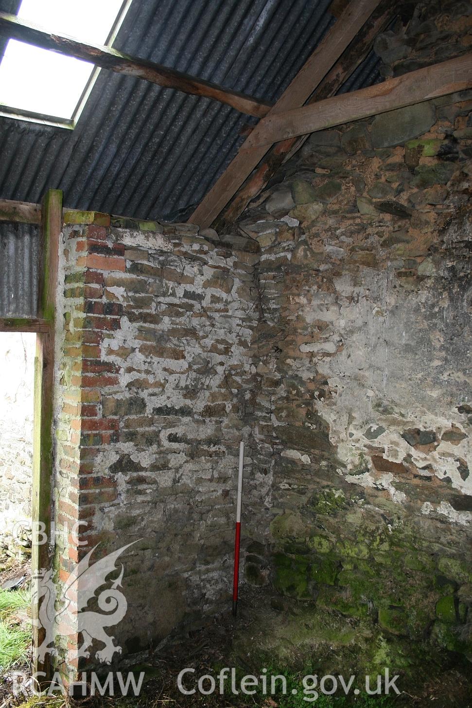 Outbuilding attached to Allt Ddu farmhouse, brick dressings in doorway.
