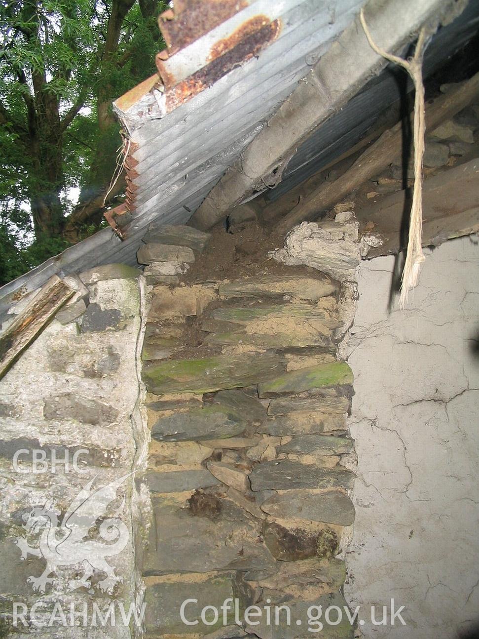 Allt Ddu farmhouse, end wall in profile against later building.