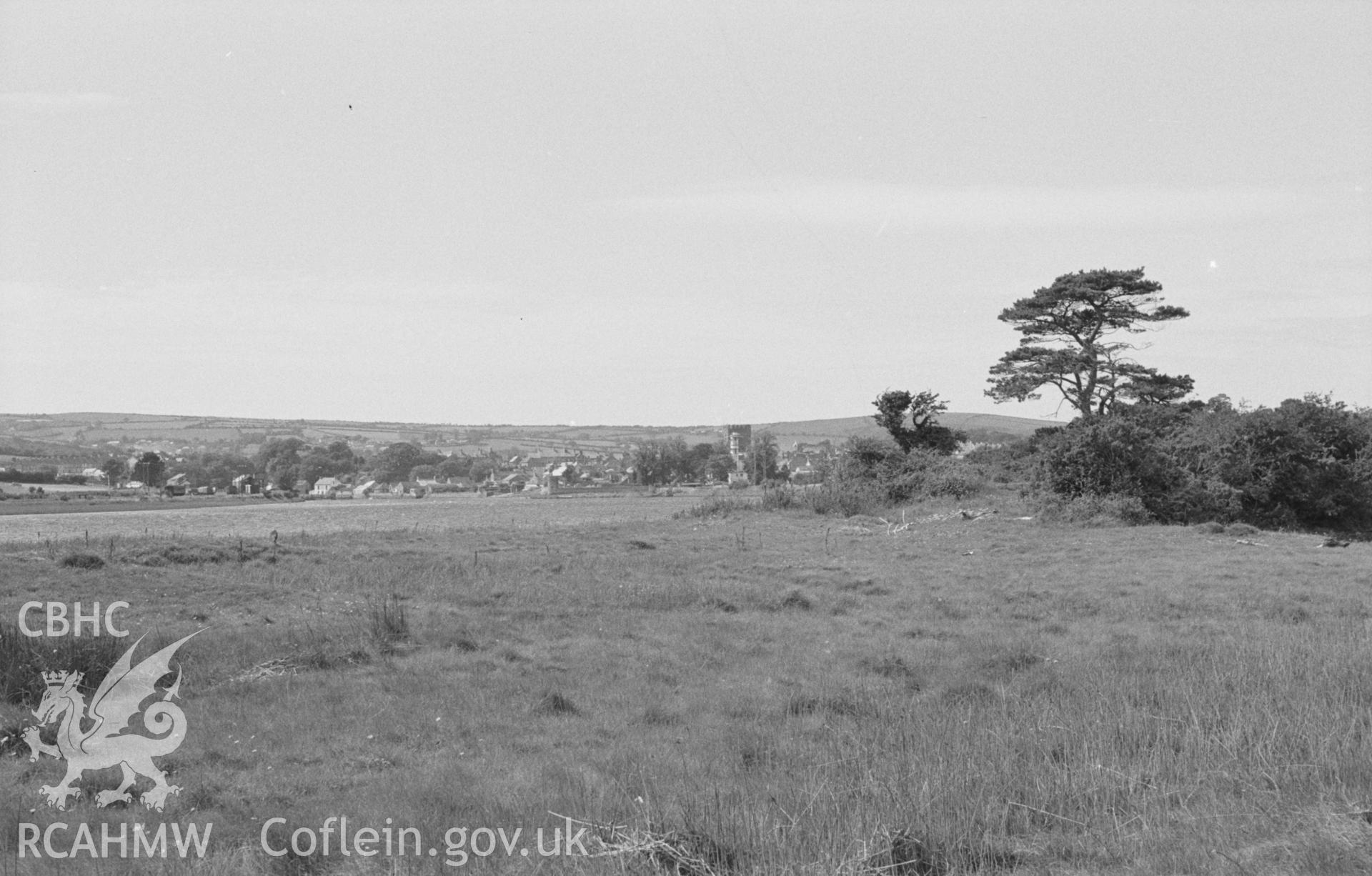Black and White photograph showing Cardigan church and town from the north side of Afon Teifi at the mouth of Nant-Rhyd-y-Fuwch. Photographed by Arthur Chater in August 1962 from Grid Reference SN 187 459, looking west.