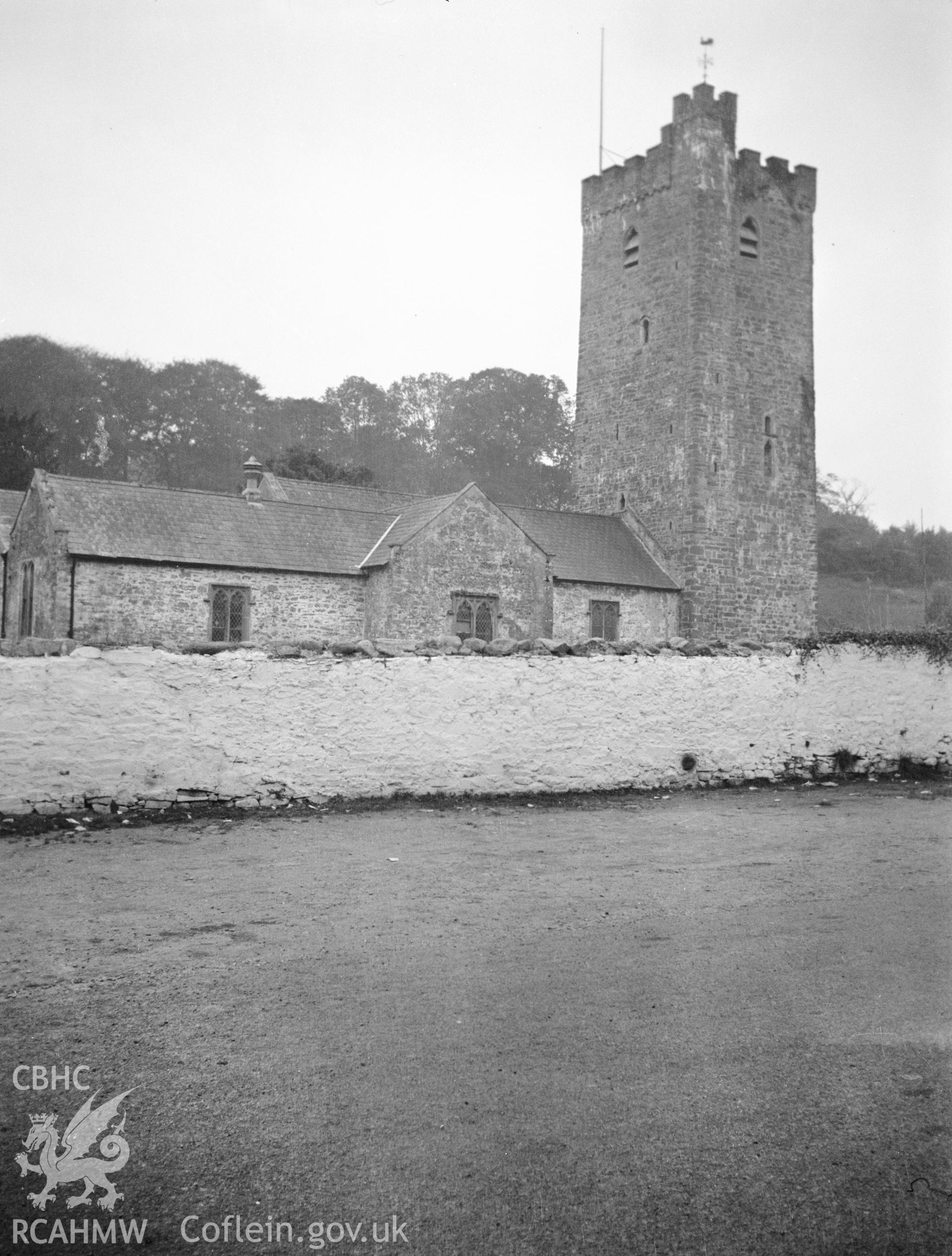 Digital copy of a nitrate negative showing view of north east exterior and white washed graveyard wall of St Stephen's Church, Llanstephan. From the National Building Record Postcard Collection.
