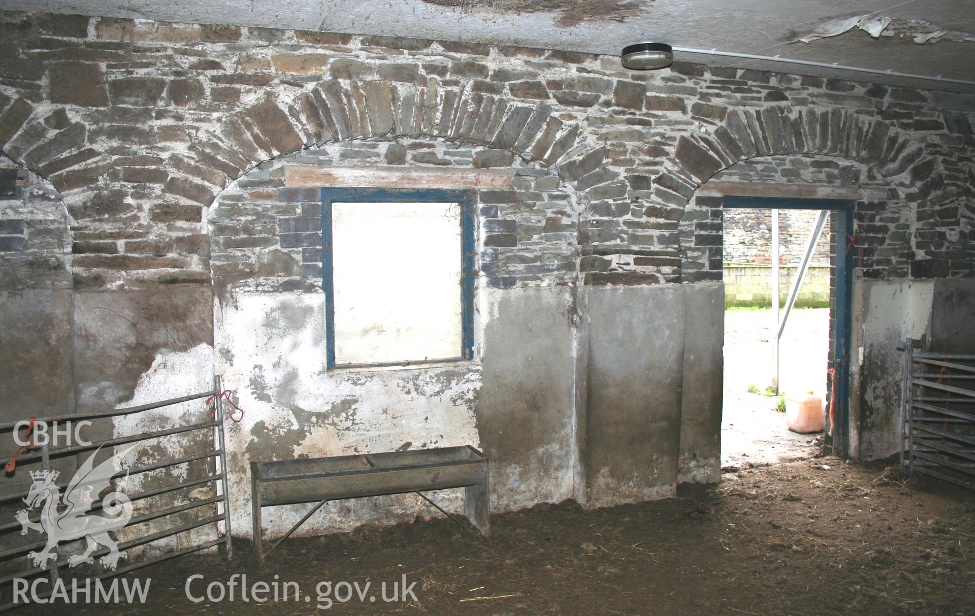 Interior view of three blocked-up stone archways. Photographic survey of the southern range of cowhouses at Tan-y-Graig Farm, Llanfarian. Conducted by Geoff Ward and John Wiles, 11th December 2006.