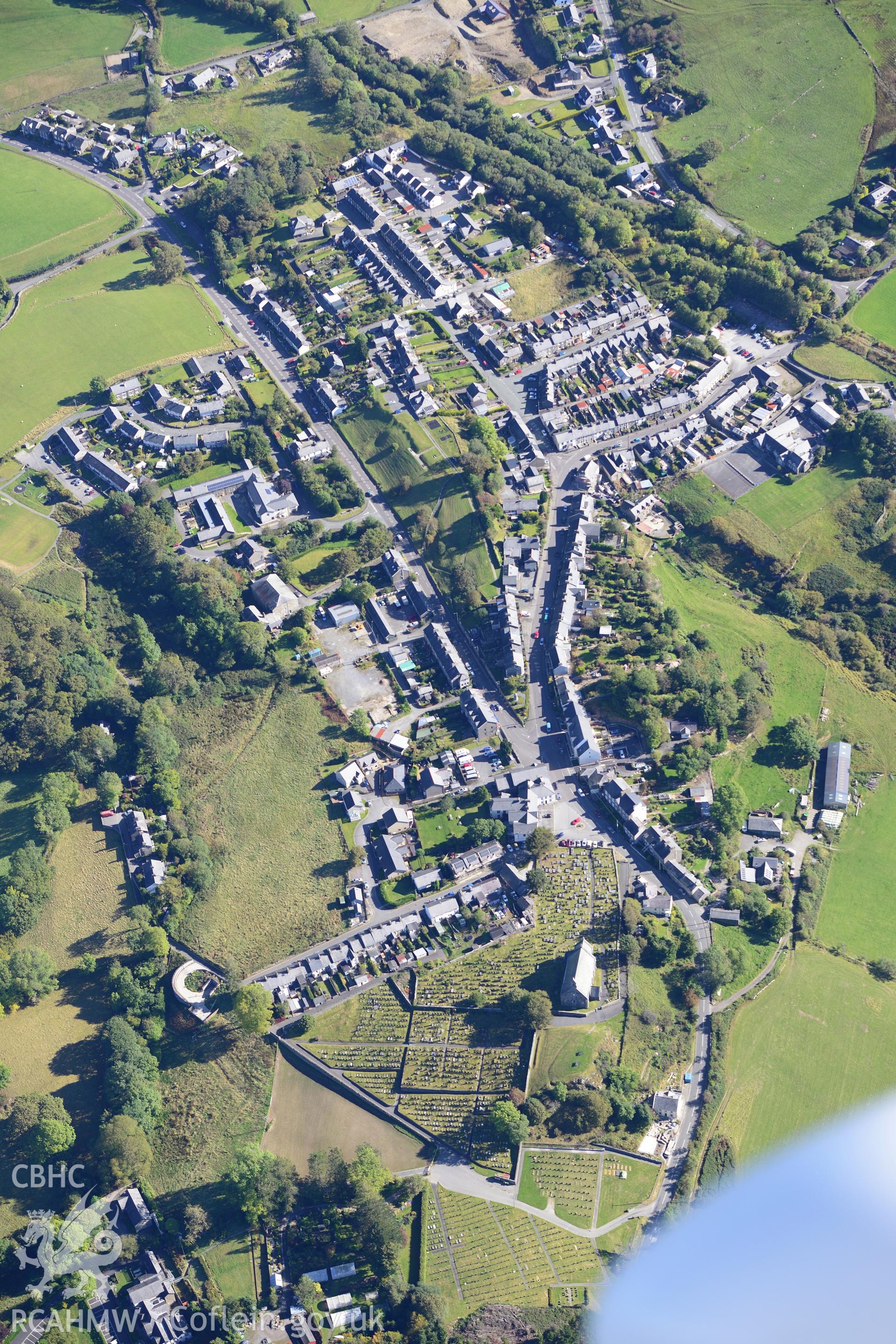 St Michael's church and the village of Llan Ffestiniog. Oblique aerial photograph taken during the Royal Commission's programme of archaeological aerial reconnaissance by Toby Driver on 2nd October 2015.