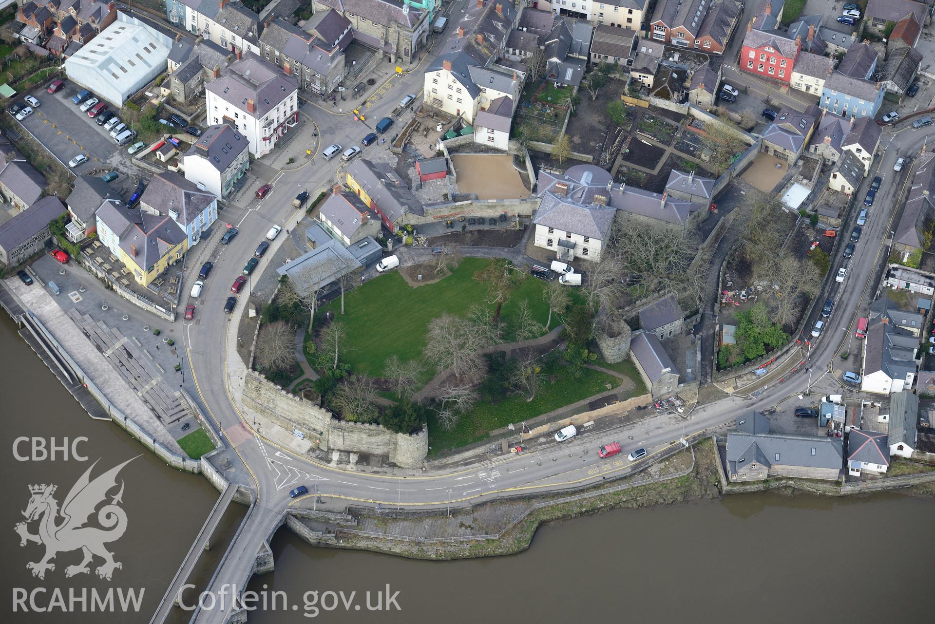 Cardigan bridge; Grovesnor hotel; Cardigan castle, house, garden, cottages, and the pillbox in the castle, Cardigan. Oblique aerial photograph taken during the Royal Commission's programme of archaeological aerial reconnaissance by Toby Driver on 13th March 2015.