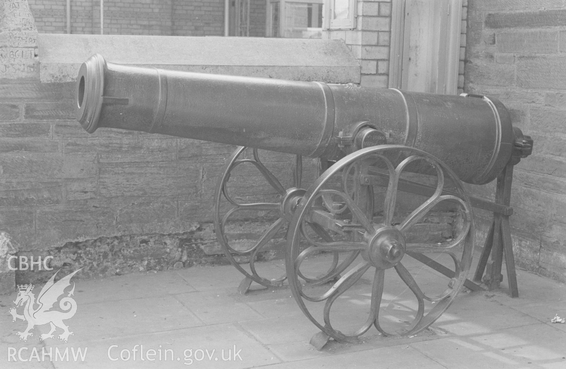 Digital copy of a black and white negative showing iron cannon at Cardigan Town Hall. Photographed by Arthur O. Chater on 9th April 1968 looking south south west from Grid Reference SN 178 460.