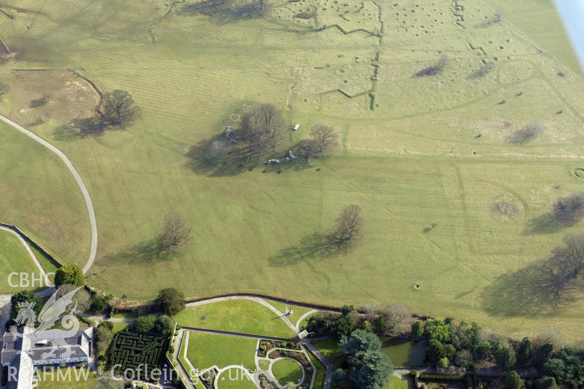 Bodelwyddan Castle garden, and Bodelwyddan Park army practise trenches, west of St. Asaph. Oblique aerial photograph taken during the Royal Commission?s programme of archaeological aerial reconnaissance by Toby Driver on 28th February 2013.