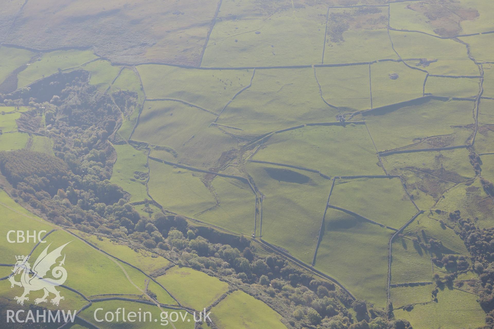 Prehistoric (and later) field system and cultivation terraces at Rhiwgaeron farm, Llwyngwril. Oblique aerial photograph taken during the Royal Commission's programme of archaeological aerial reconnaissance by Toby Driver on 2nd October 2015.
