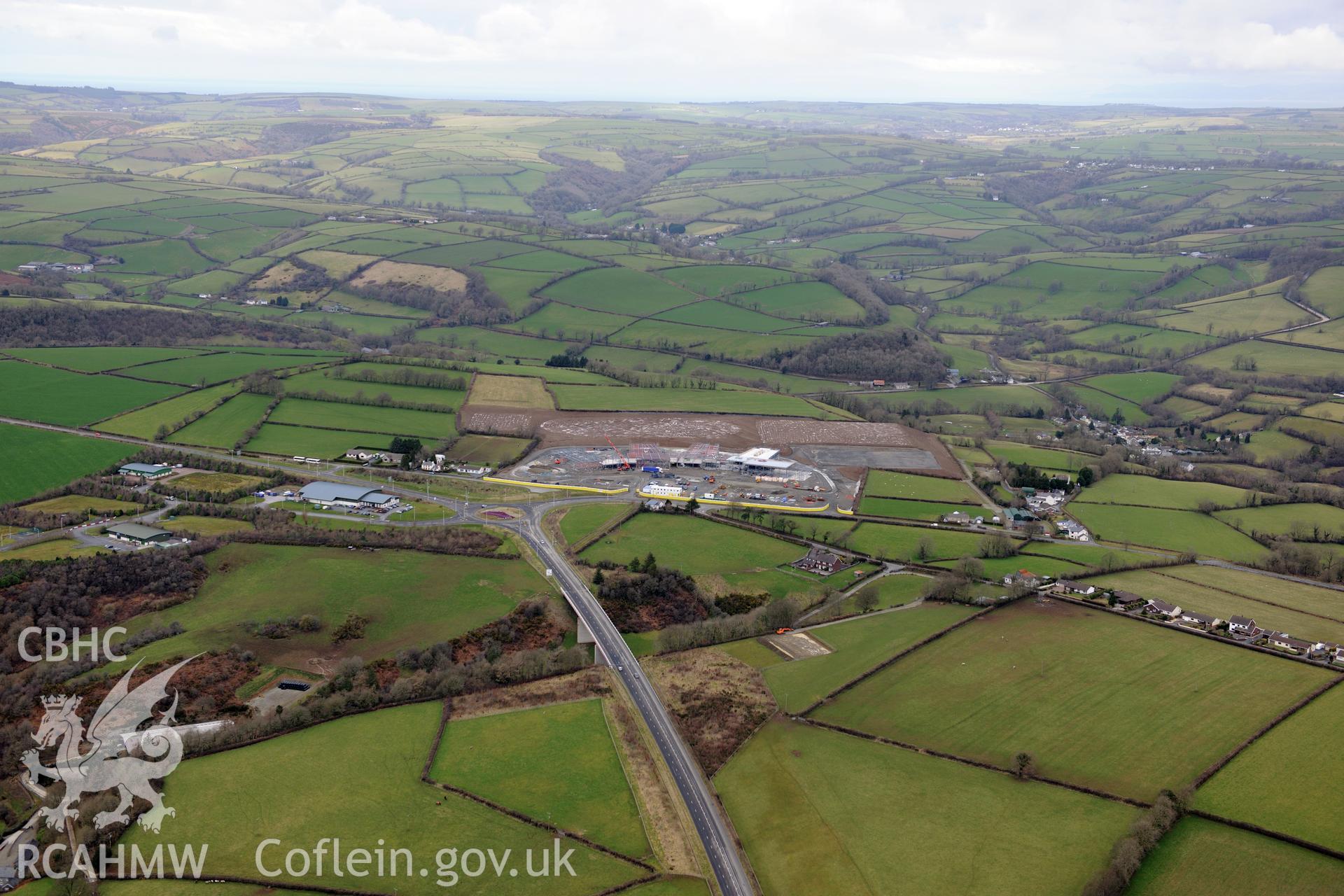 Ysgol Bro Teifi under construction and the A486 Llandysul bypass, on the northern outskirts of Llandysul. Oblique aerial photograph taken during the Royal Commission's programme of archaeological aerial reconnaissance by Toby Driver on 13th March 2015.