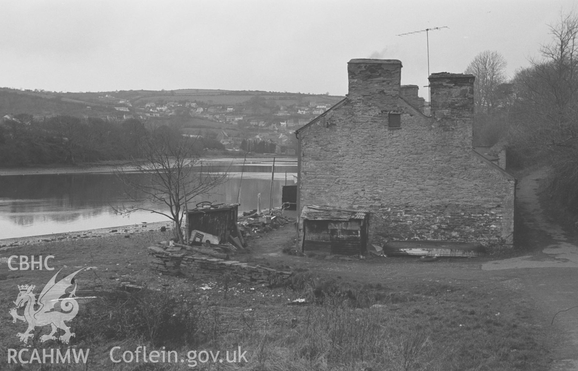 Digital copy of a black and white negative showing old houses (1,2 and 3 Net Pool Road) at the west end of Net Pool, Cardigan. St. Dogmaels in distance. Photographed by Arthur O. Chater in September 1966 looking west from Grid Reference SN 1733 4602.