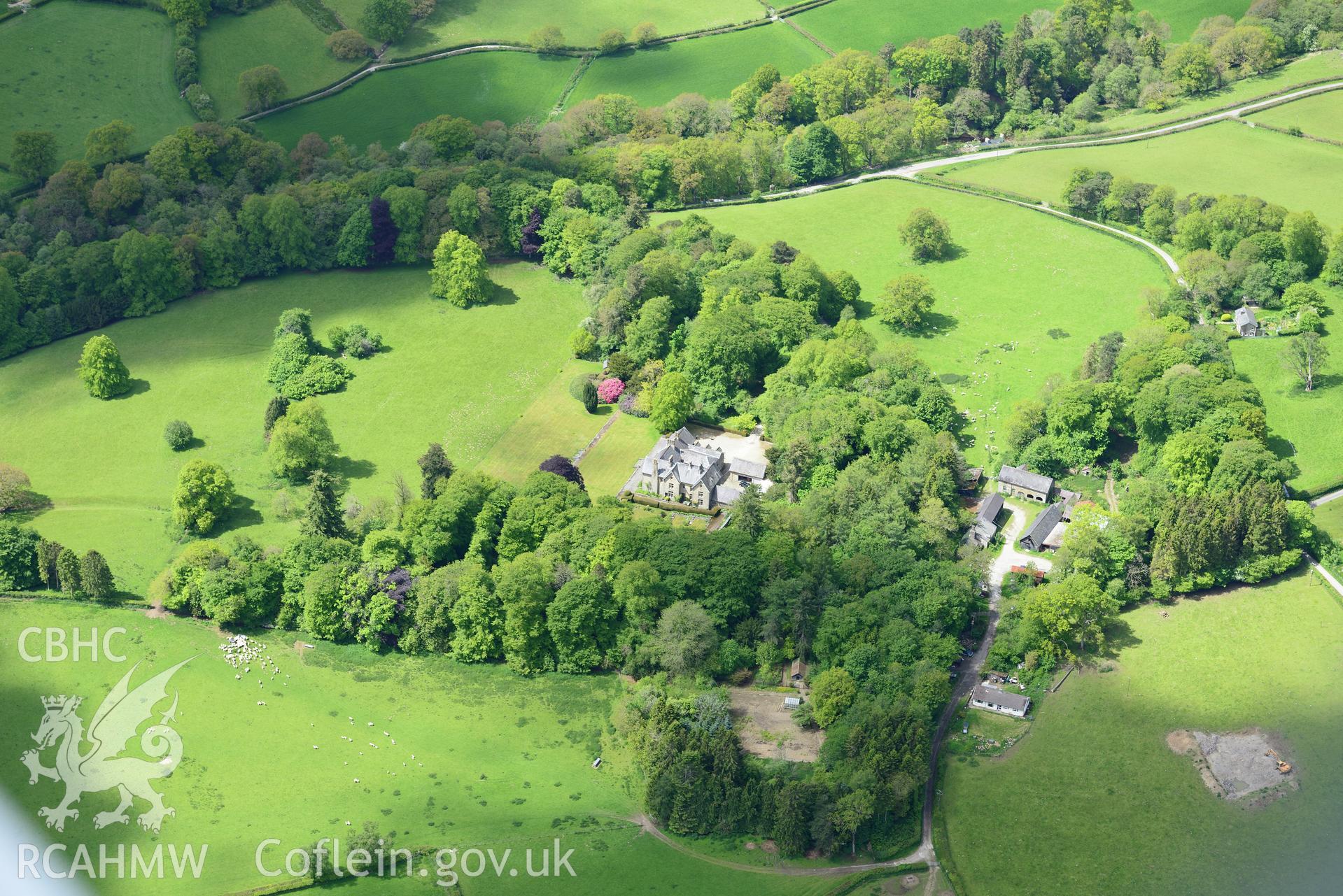 Derw country house and garden and Derw home farm including cowhouse, barn, sawmill, stable and cartshed. Oblique aerial photograph taken during the Royal Commission's programme of archaeological aerial reconnaissance by Toby Driver on 3rd June 2015.