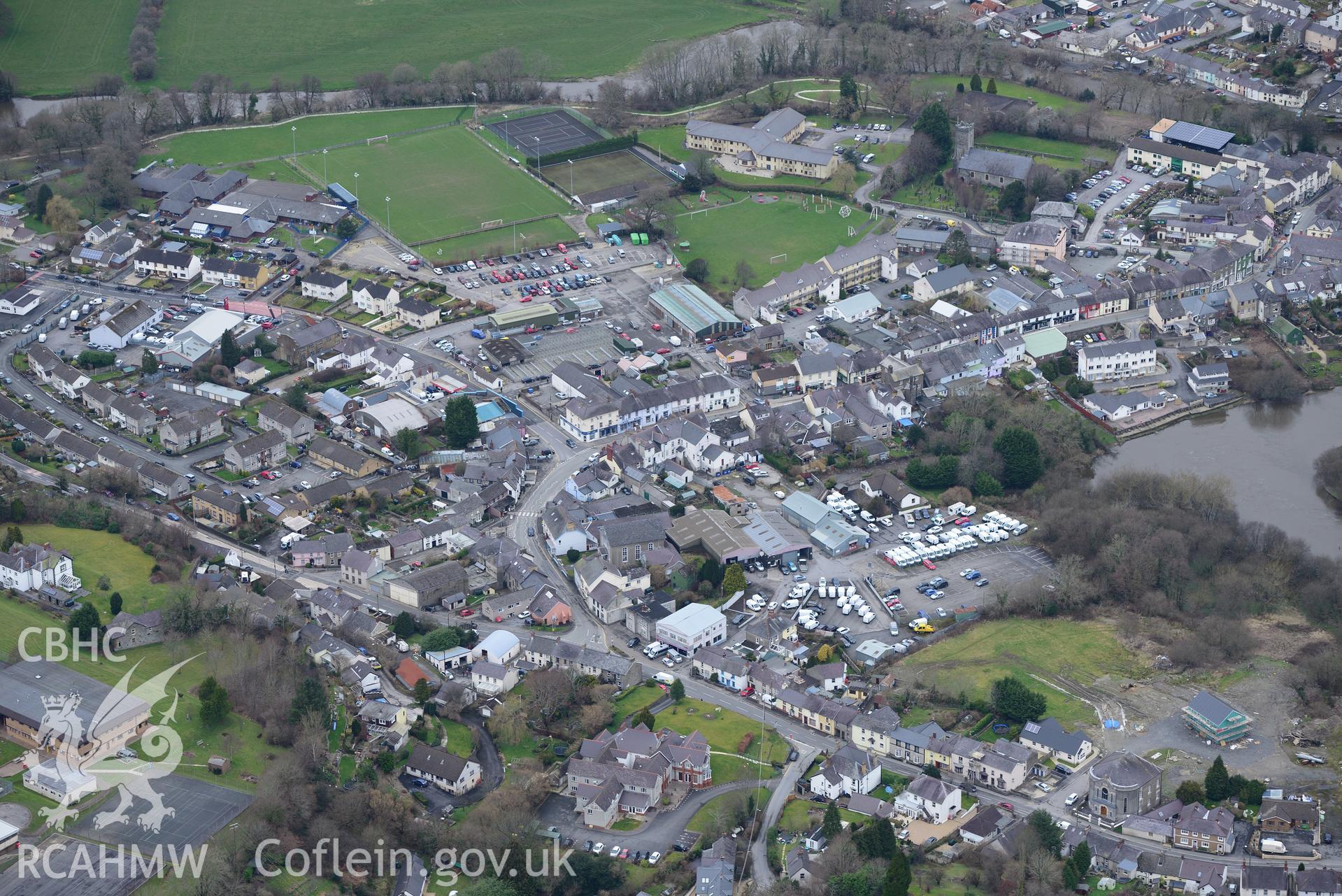 Holy Trinity Church, Y Graig Welsh Baptist church, Ysgol Gyfun Emlyn and the town leisure centre, Newcastle Emlyn. Oblique aerial photograph taken during Royal Commission?s programme of archaeological aerial reconnaissance by Toby Driver on 13th May 2015.