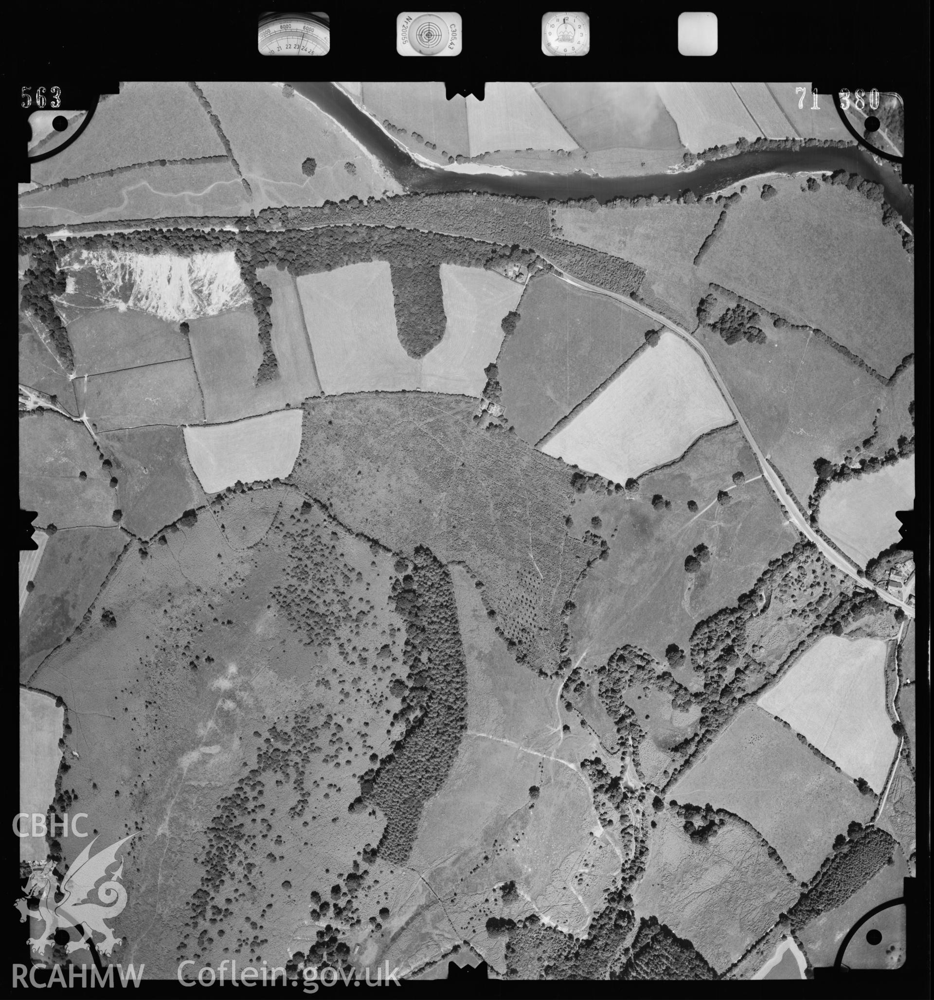 Digital copy of a black and white aerial photograph of an area near Builth Wells, taken by the Ordnance Survey in 1971, at an altitude of 6,600 feet. Grid reference SO0550.