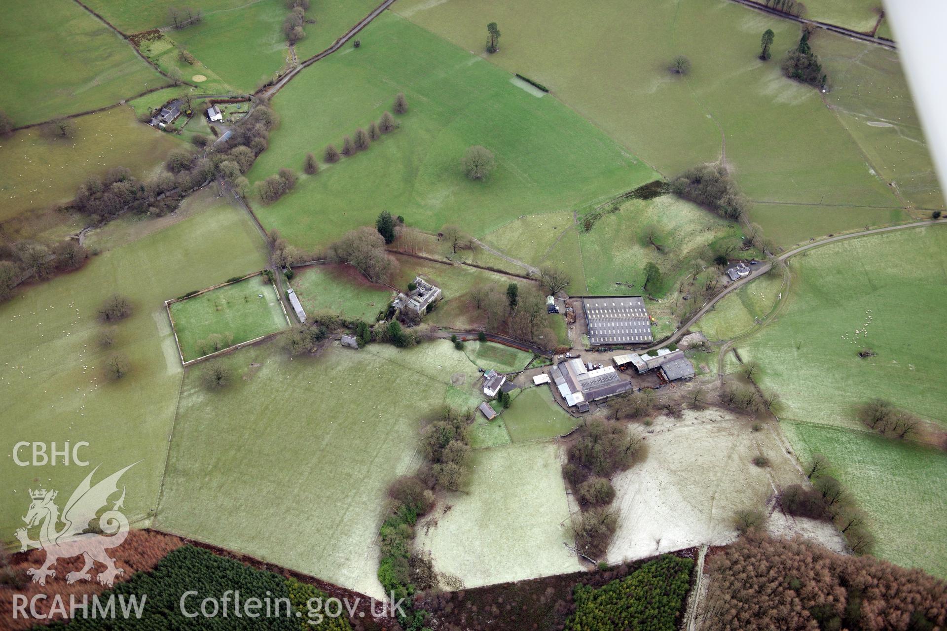 Neuadd Fawr and its associated garden, potting sheds, stables, and home farm, Cilycwm, south west of Llanwrtyd Wells. Oblique aerial photograph taken during Royal Commission?s programme of archaeological aerial reconnaissance by Toby Driver, 15 Jan 2013.