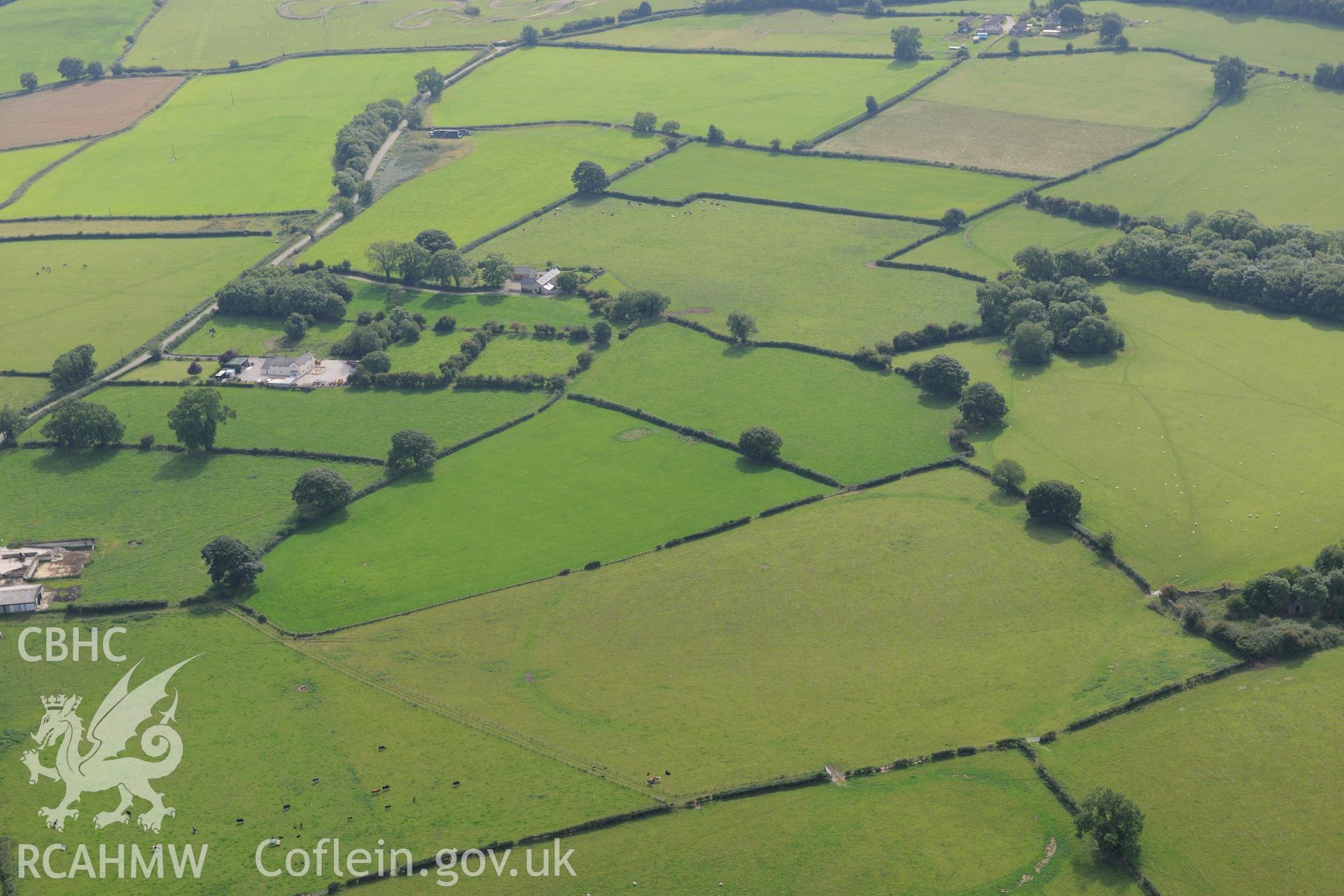 Llynfanod round barrow, near Holywell. Oblique aerial photograph taken during the Royal Commission's programme of archaeological aerial reconnaissance by Toby Driver on 11 September 2015.