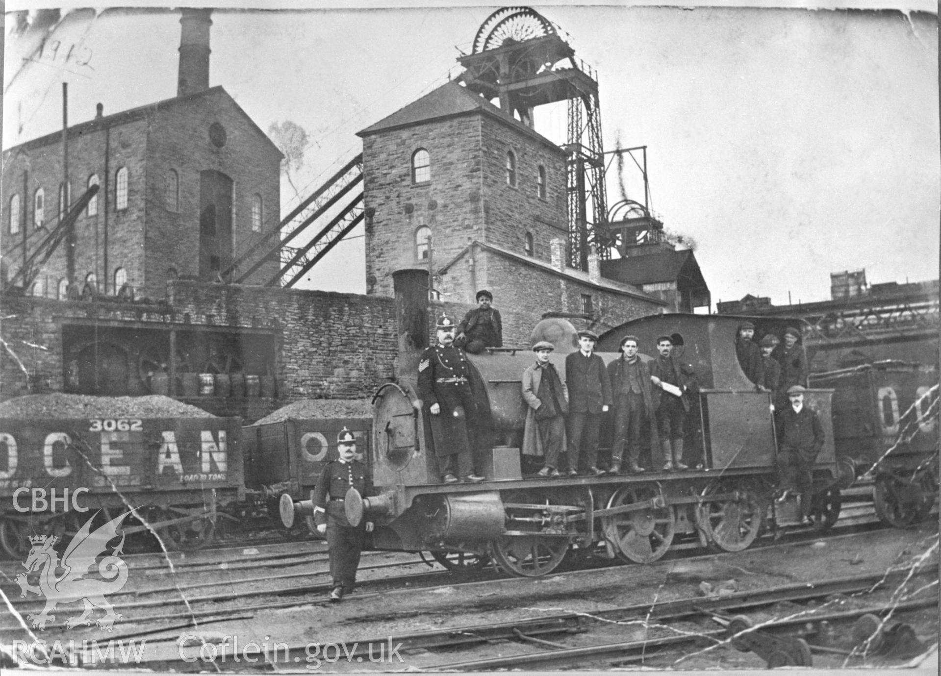 Digital copy of an acetate negative showing group of men, some police officers, on coal train engine at Ocean Deep Navigation Colliery, from the John Cornwell Collection.