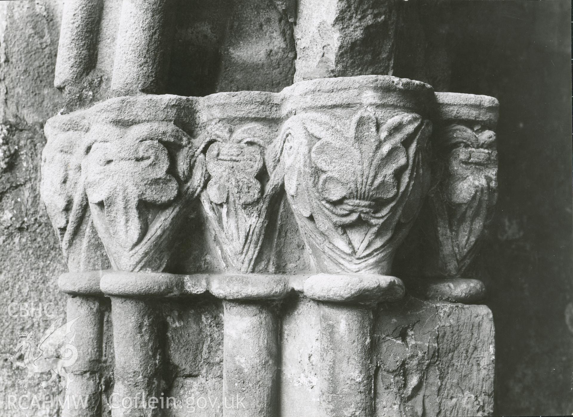Digitised copy of a black and white photograph showing detail of archway to cloister on east side of  Valle Crucis Abbey, taken by F.H. Crossley, 1949. Copied from print as negative held by NMR England (Historic England).