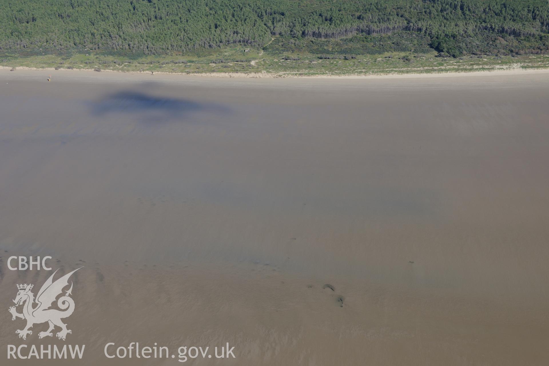 Post medieval wreck on the Cefn Sidan sands, Pembrey, at low tide. Oblique aerial photograph taken during the Royal Commission's programme of archaeological aerial reconnaissance by Toby Driver on 30th September 2015.