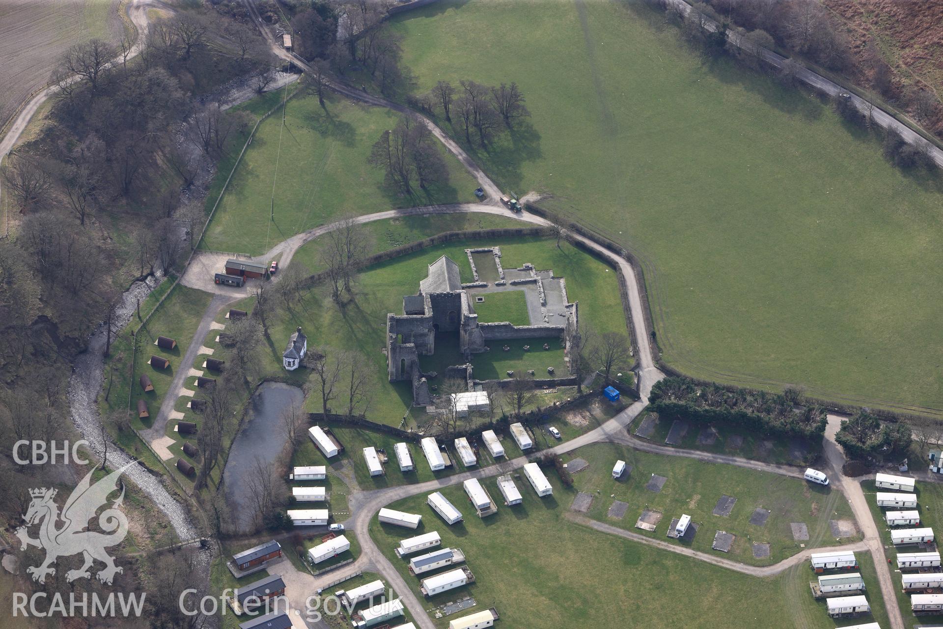 Vale Crucis Abbey and the small cottage nearby (the buildings next to the pond). Oblique aerial photograph taken during the Royal Commission?s programme of archaeological aerial reconnaissance by Toby Driver on 28th February 2013.