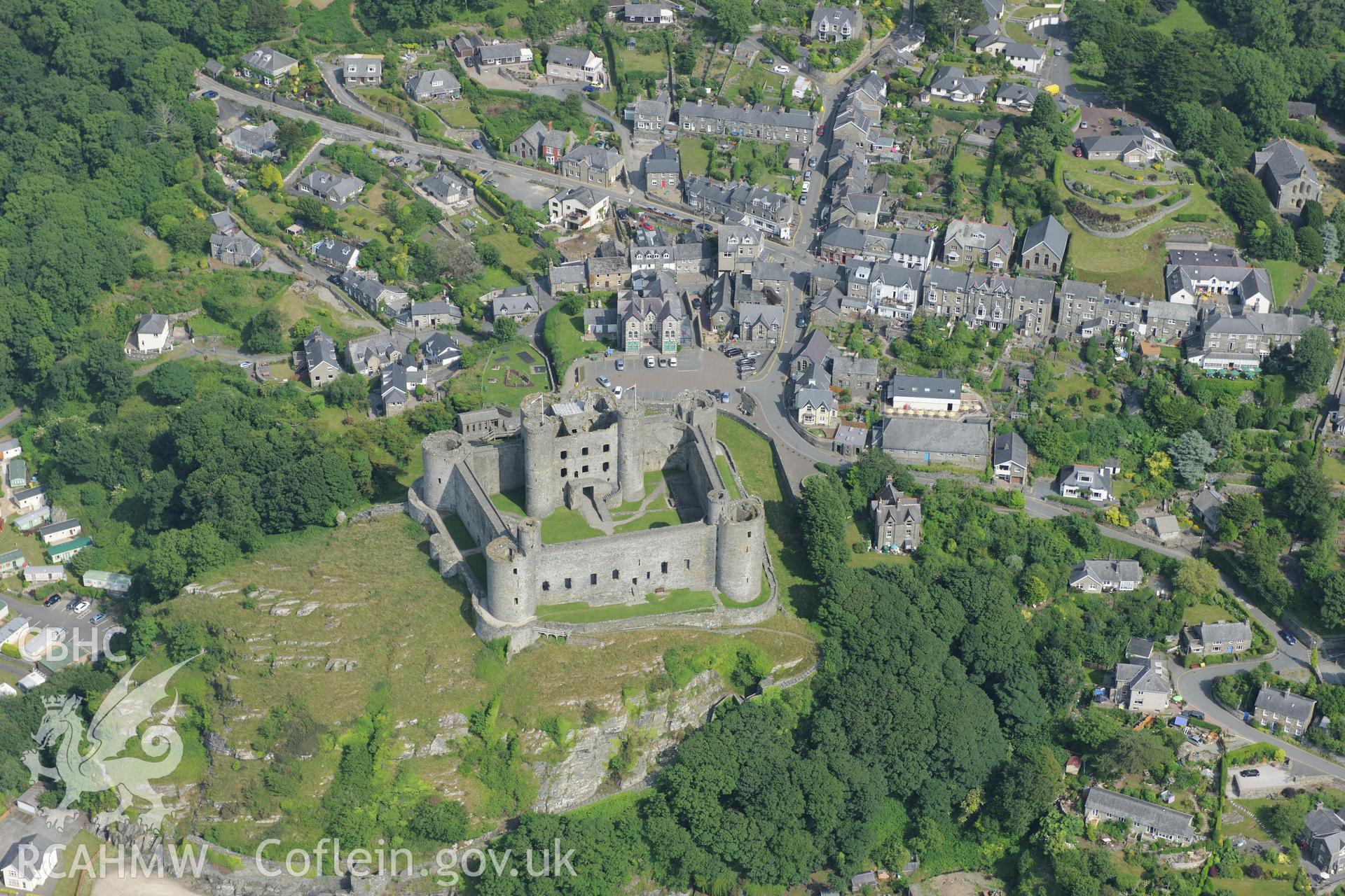 Harlech Castle, overlooking Harlech. Oblique aerial photograph taken during the Royal Commission?s programme of archaeological aerial reconnaissance by Toby Driver on 12th July 2013.