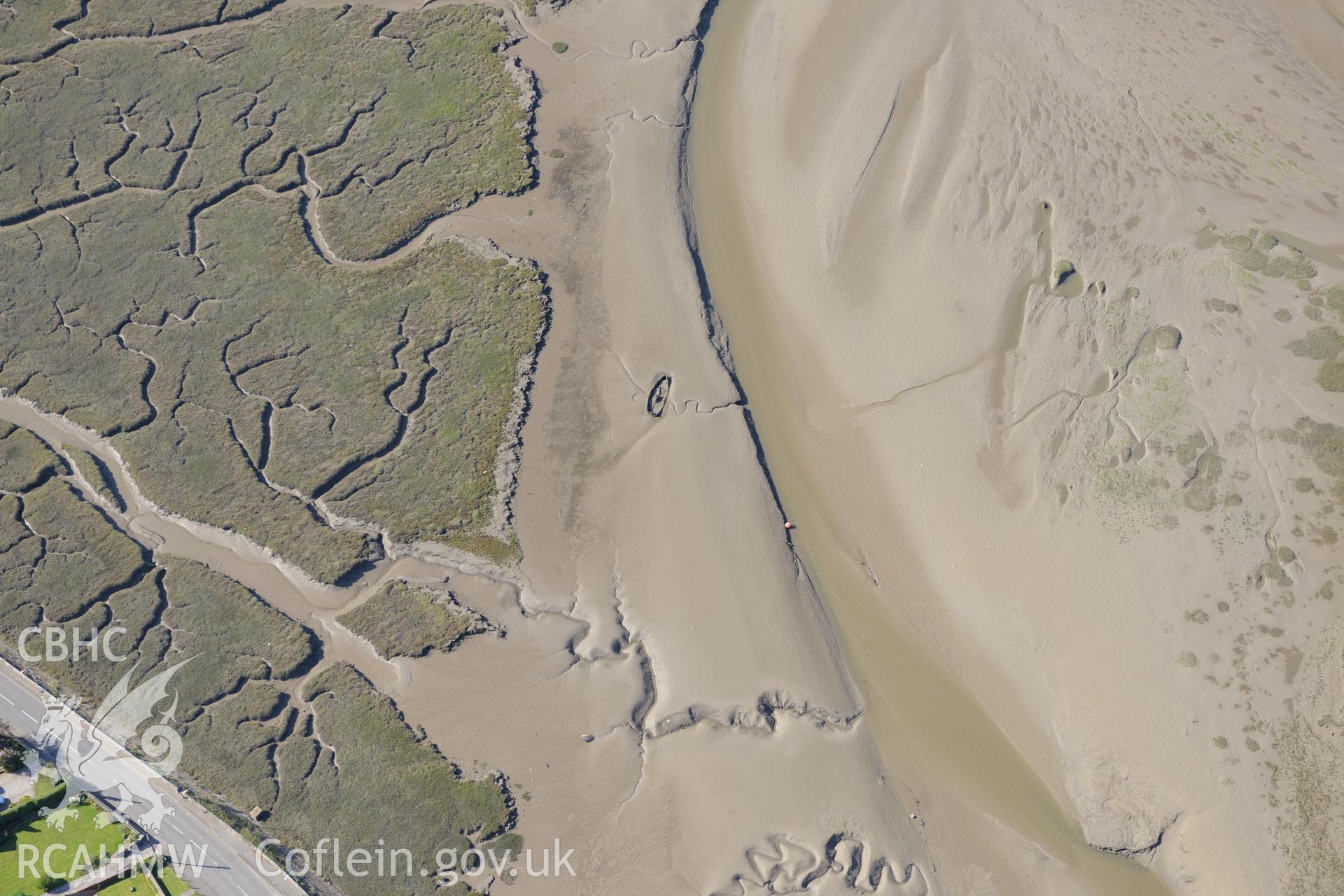 Hull or wreck off the northern coast of the Gower Peninsula, near Penclawdd. Oblique aerial photograph taken during the Royal Commission's programme of archaeological aerial reconnaissance by Toby Driver on 30th September 2015.