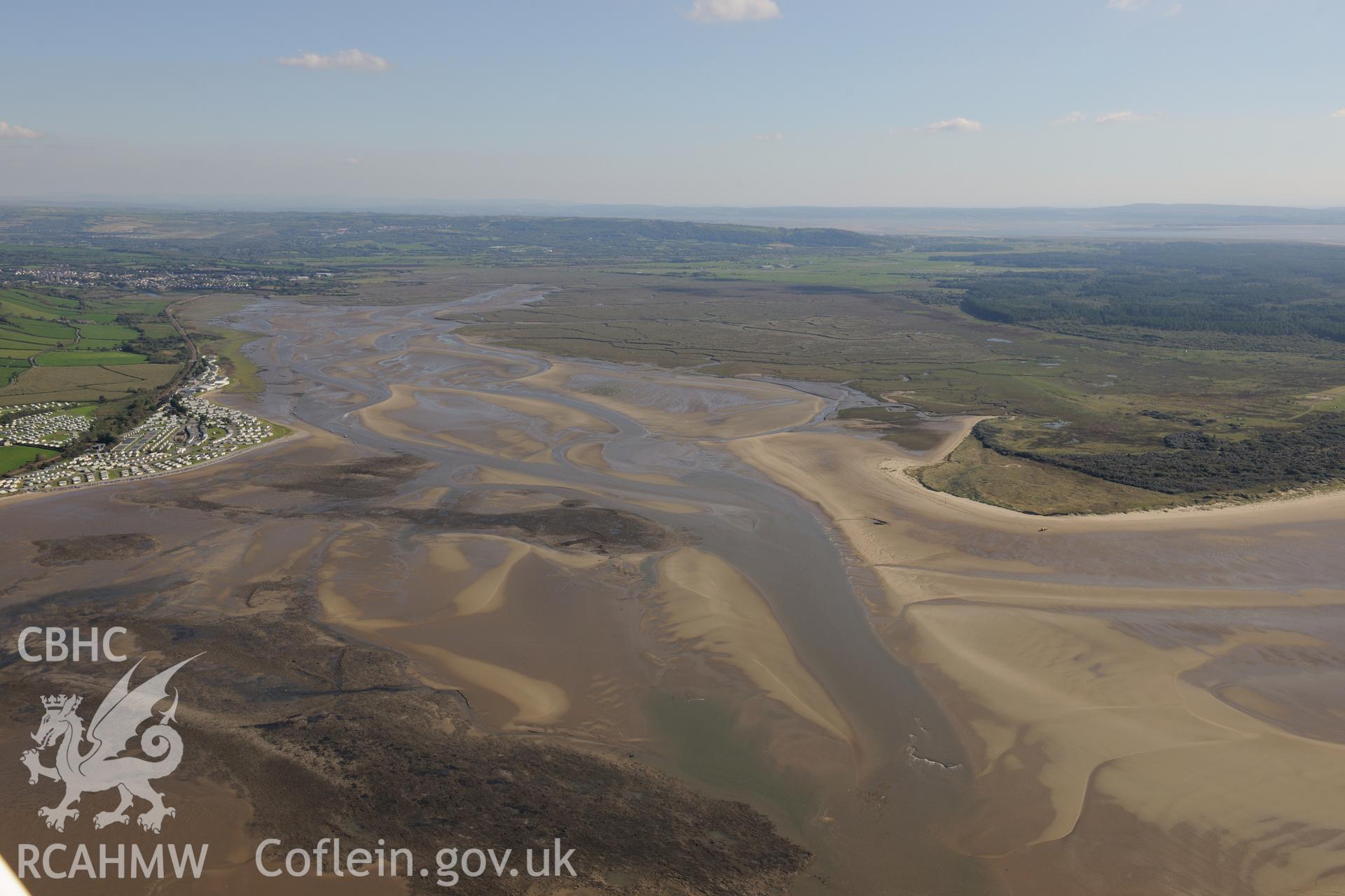 Fishtraps I to N of the fish trap complex, salmon scar and pastoun scar, on the mudflats of the Gwendraeth Fawr estuary, west of Kidwelly. Oblique aerial photograph taken during the Royal Commission's programme of archaeological aerial reconnaissance by Toby Driver on 30th September 2015.